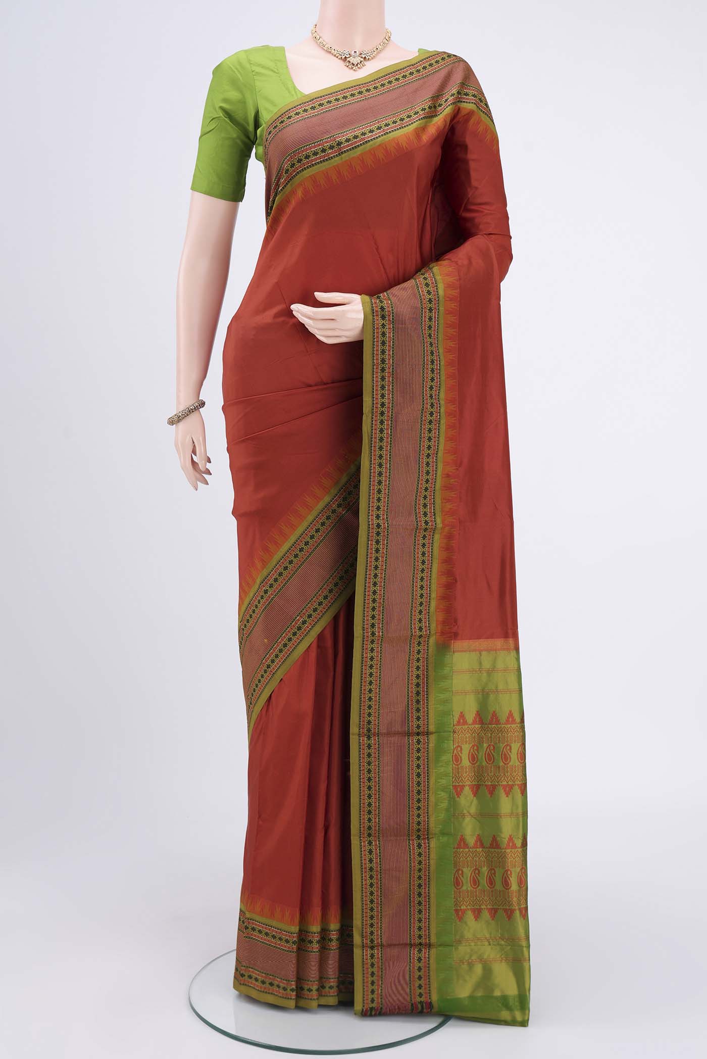 Rust Bangalore Silk - kadyal Saree with Plain Body and Thread Border.  displayed on a mannequin