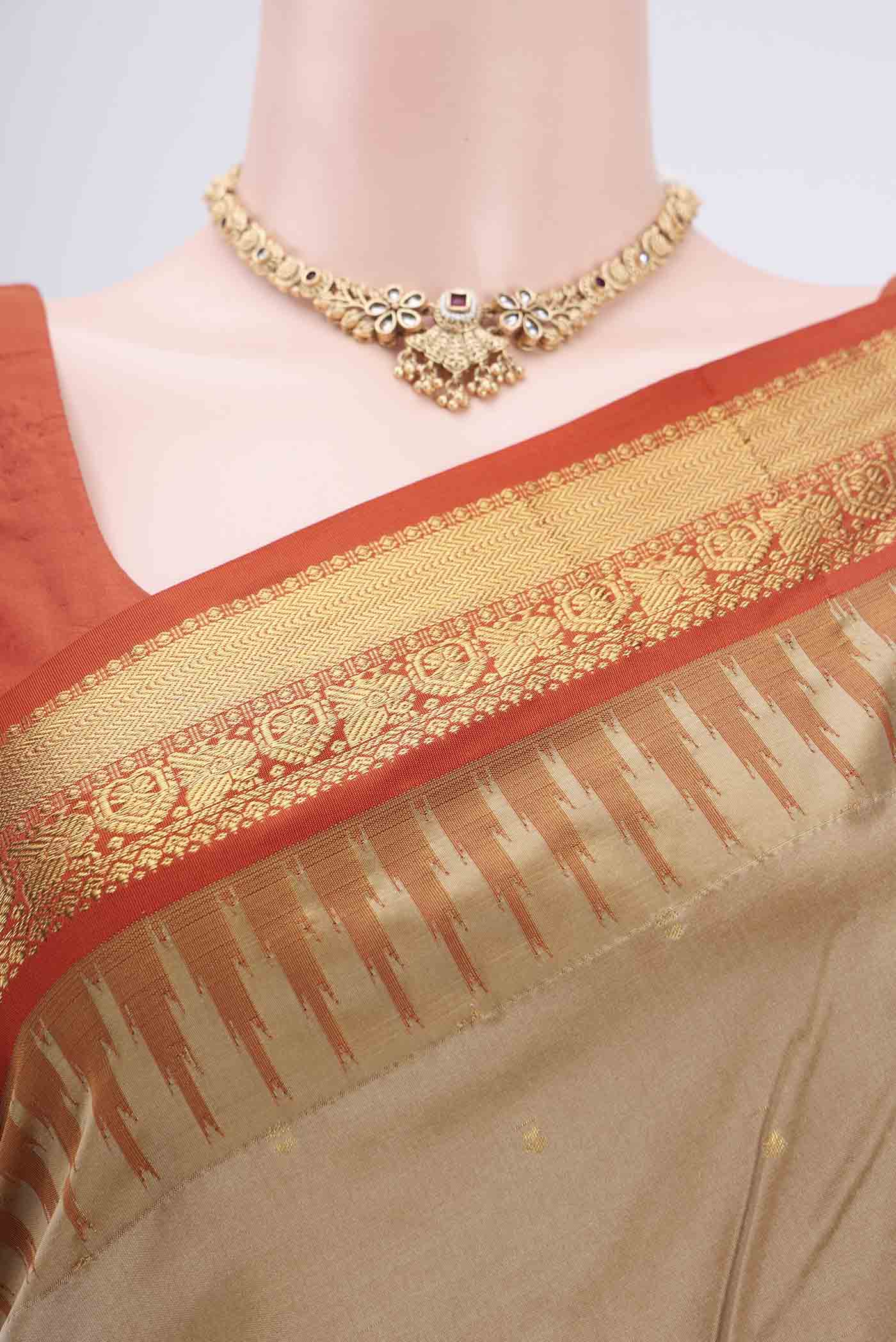 Border image of Dark Beige Bangalore Silk - kadyal Saree with Zari Butta on the body and Zari Border. 