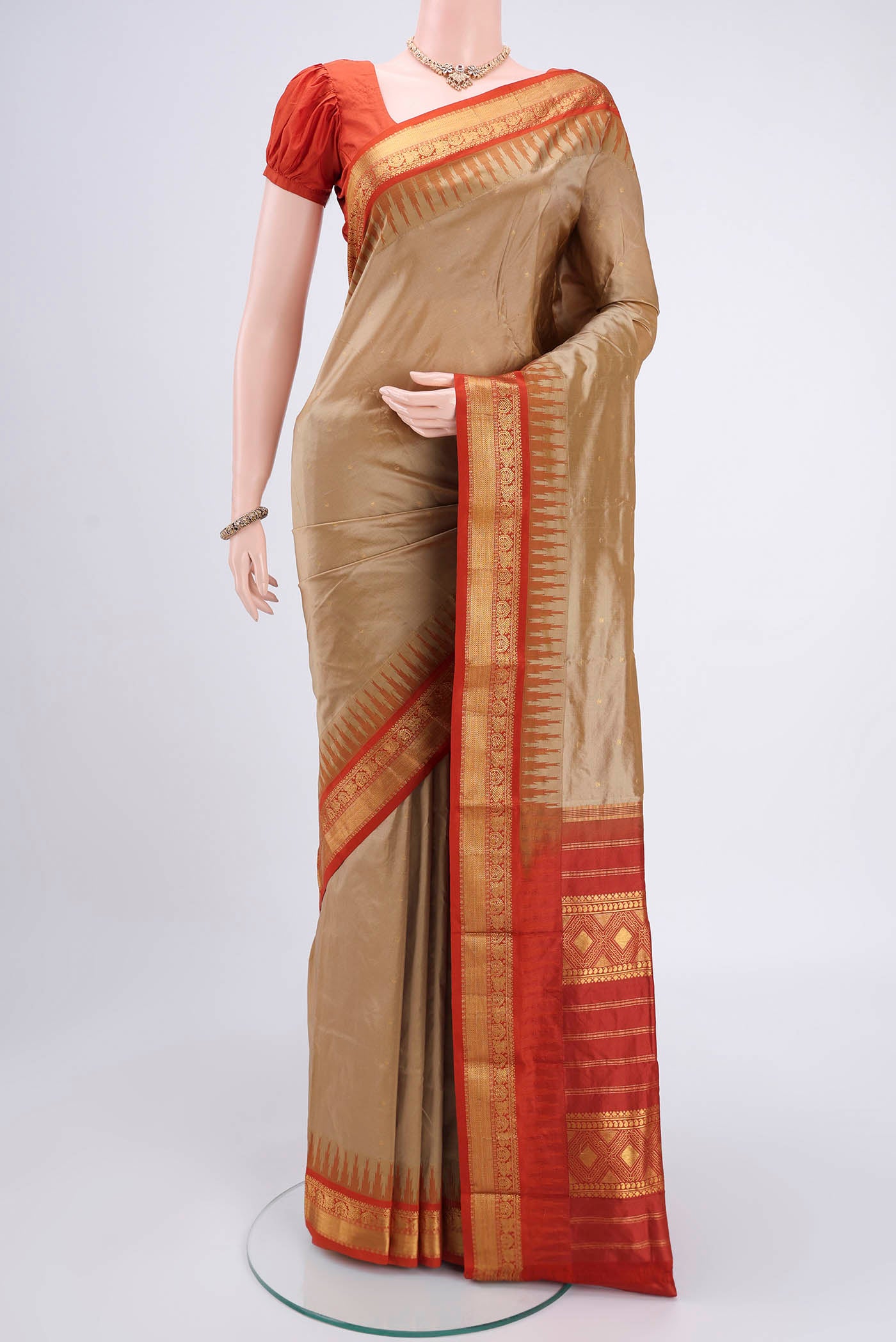 Dark Beige Bangalore Silk - kadyal Saree with Zari Butta on the body and Zari Border.  displayed on a mannequin