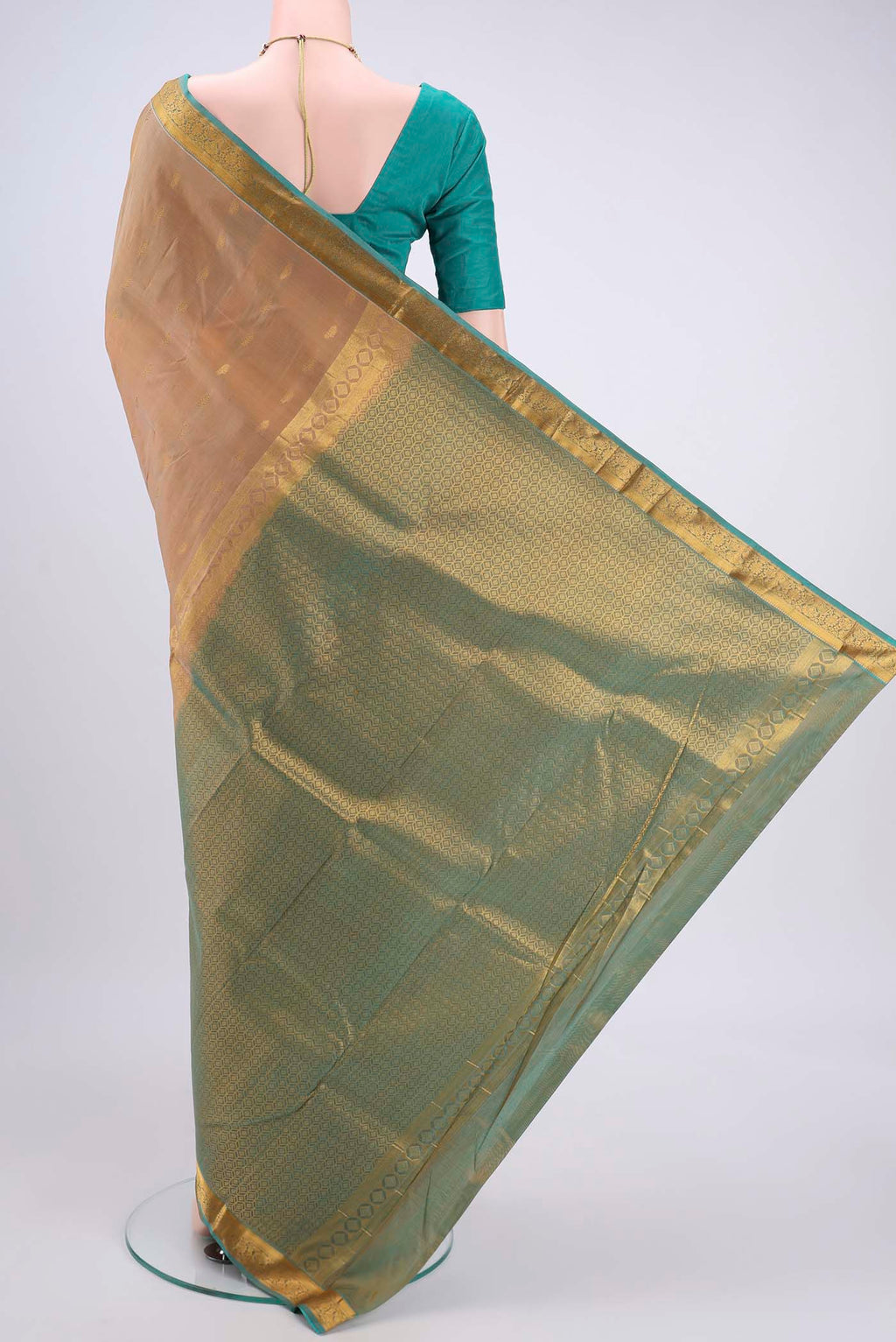 Flat view of Beige Kanjivaram Silk Saree with Zari Butta on the body and Zari Border. 