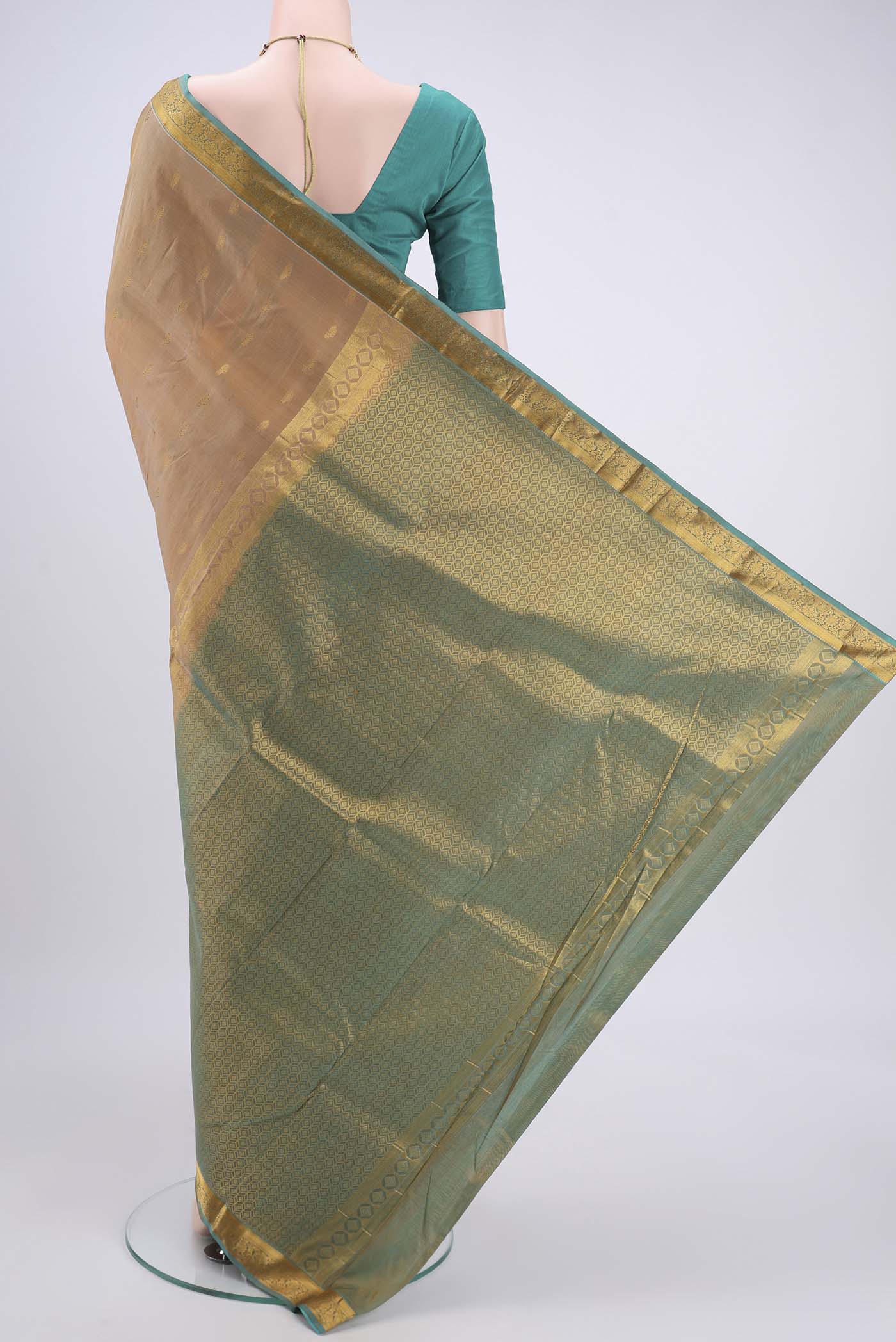 Flat view of Beige Kanjivaram Silk Saree with Zari Butta on the body and Zari Border. 