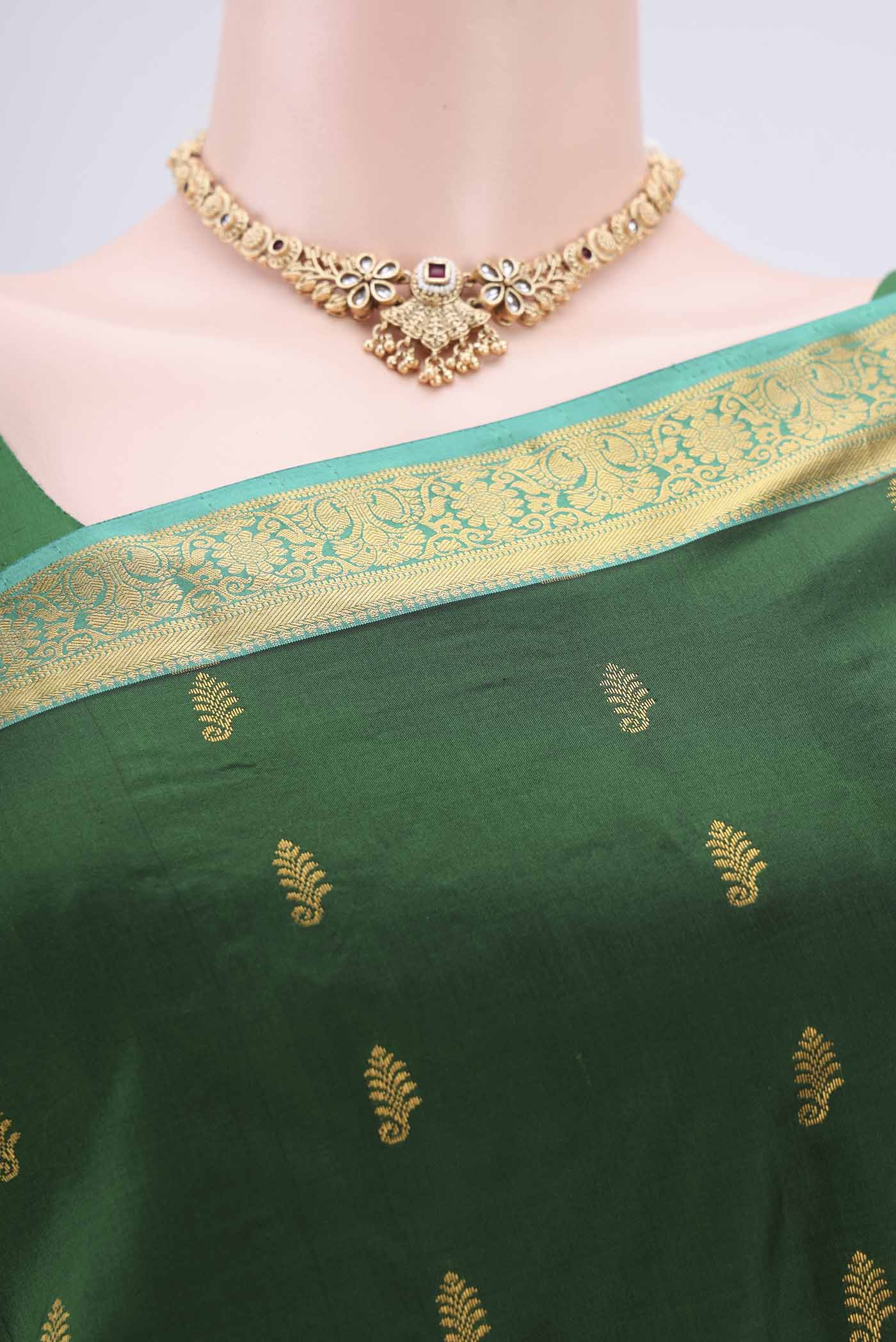 Border image of Bottle Green Kanjivaram Silk Saree with Zari Butta on the body and Zari Border. 