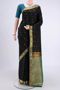 Black Kanjivaram Silk Saree with Zari Butta on the body and Zari Border.  displayed on a mannequin