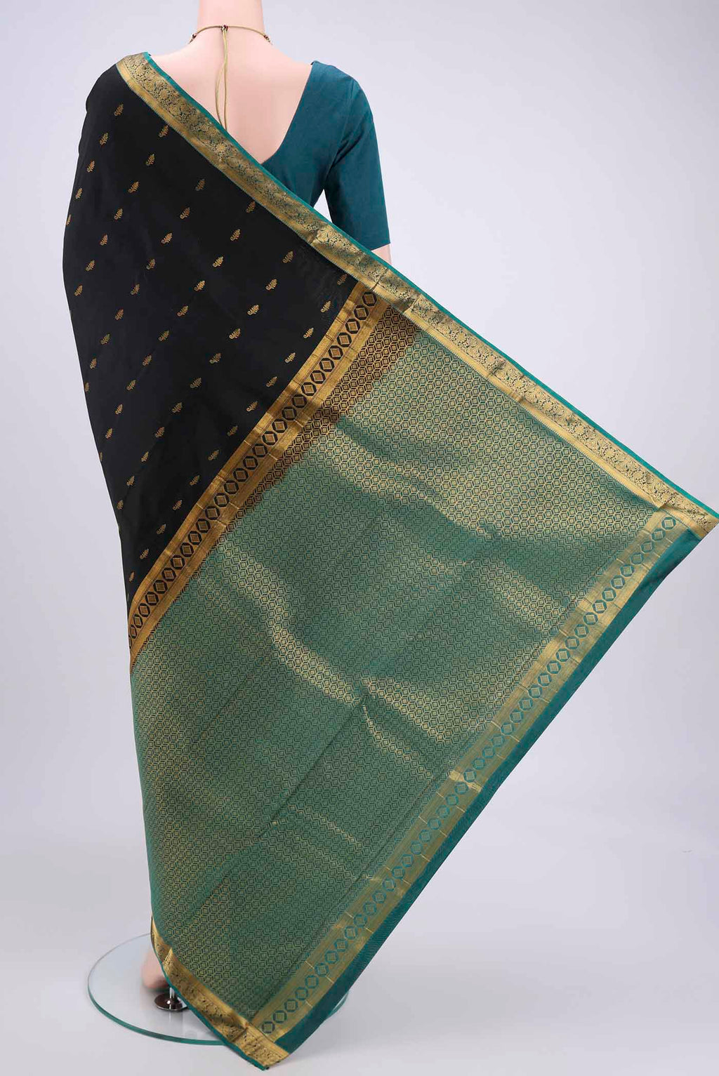 Flat view of Black Kanjivaram Silk Saree with Zari Butta on the body and Zari Border. 