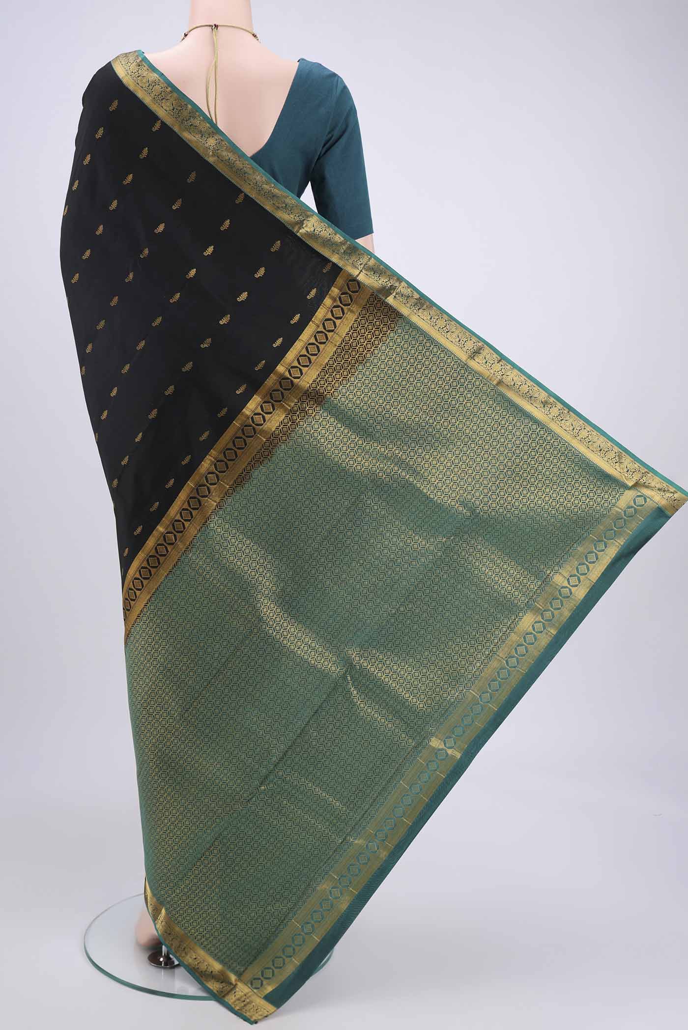 Flat view of Black Kanjivaram Silk Saree with Zari Butta on the body and Zari Border. 