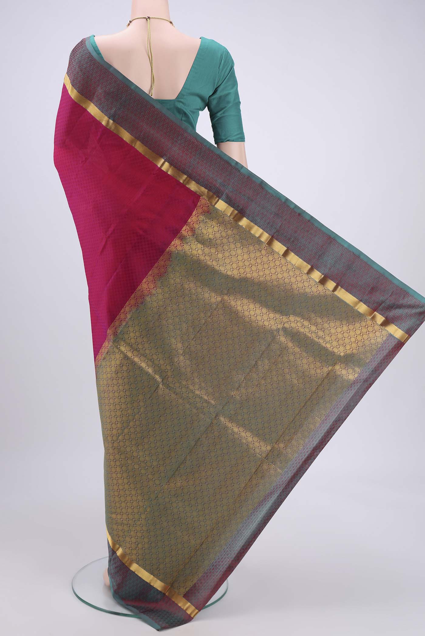 Flat view of Pink Kanjivaram Silk Saree with Zari Butta on the body and Zari Border. 