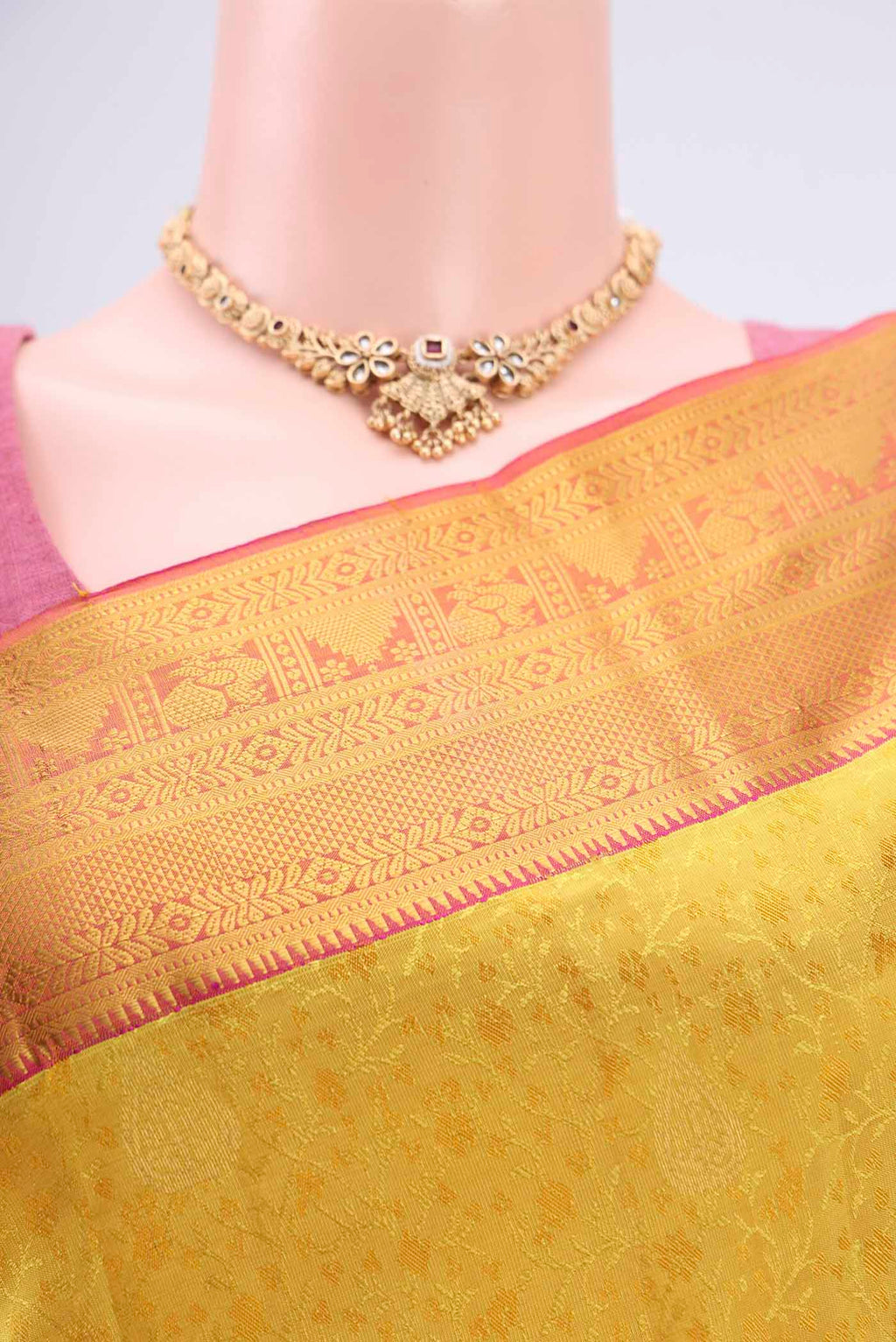 Border image of Yellow Kanchipuram Silk Saree with Zari Butta on the body and Zari Border. 