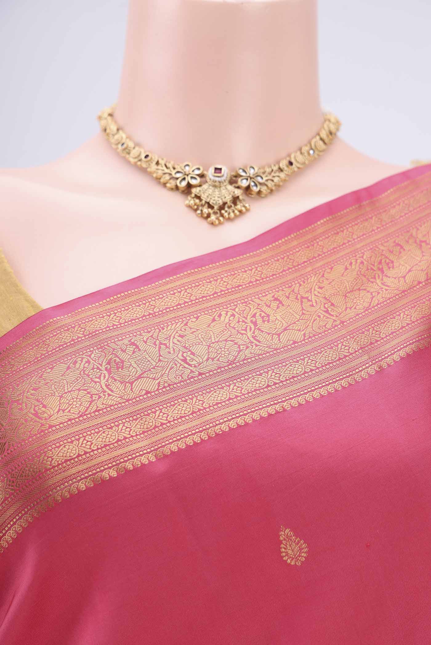 Border image of Pink Kanchipuram Silk Saree with Zari Butta on the body and Zari Border. 