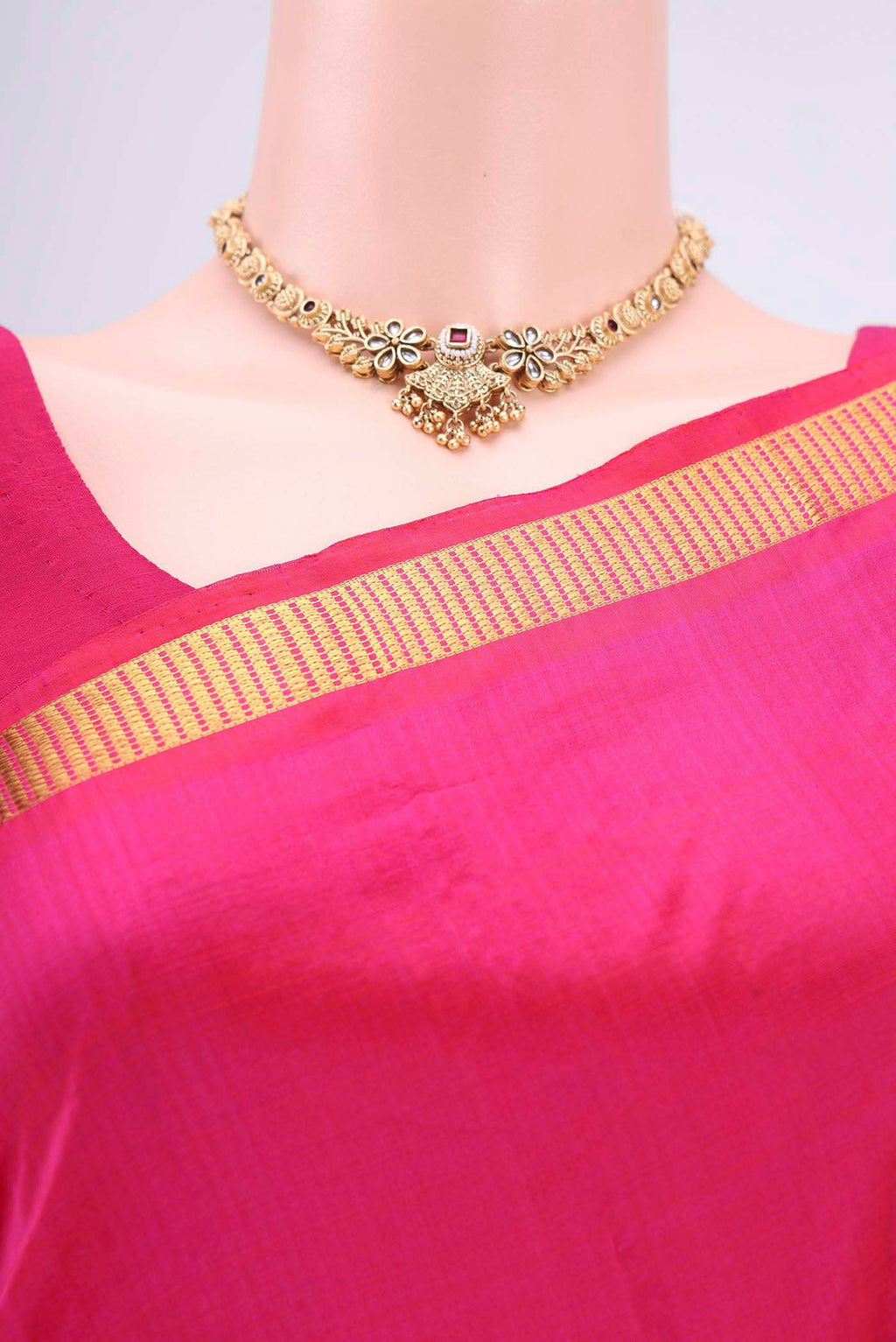 Border image of Rani Pink Dual Tone Kanchipuram Silk Saree with Plain Body and Zari Border. 
