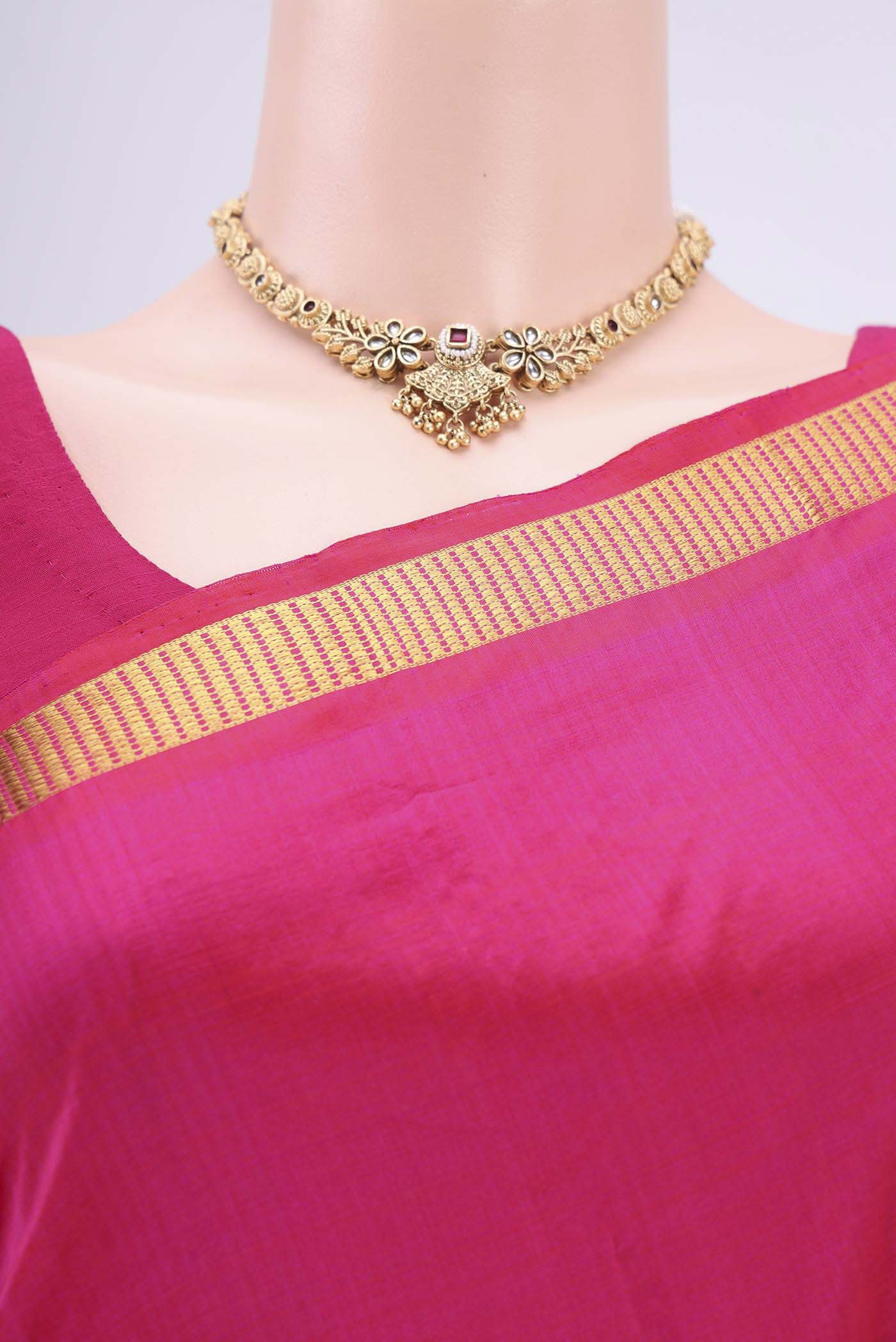 Border image of Rani Pink Dual Tone Kanchipuram Silk Saree with Plain Body and Zari Border. 