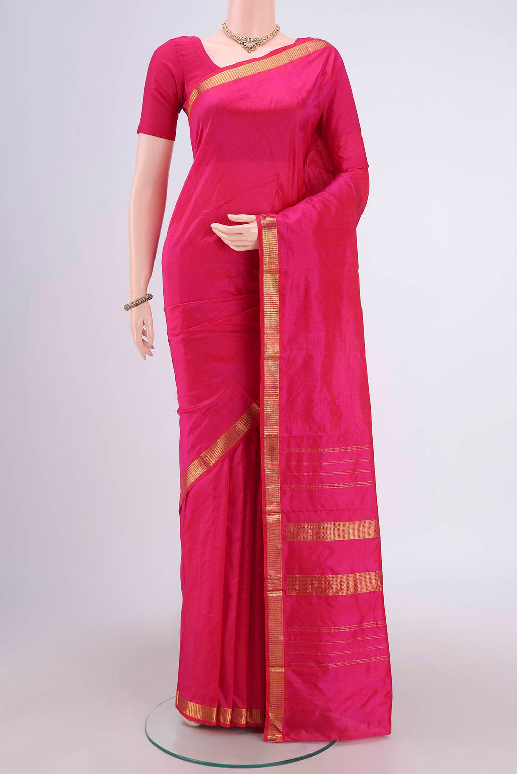 Rani Pink Dual Tone Kanchipuram Silk Saree with Plain Body and Zari Border.  displayed on a mannequin