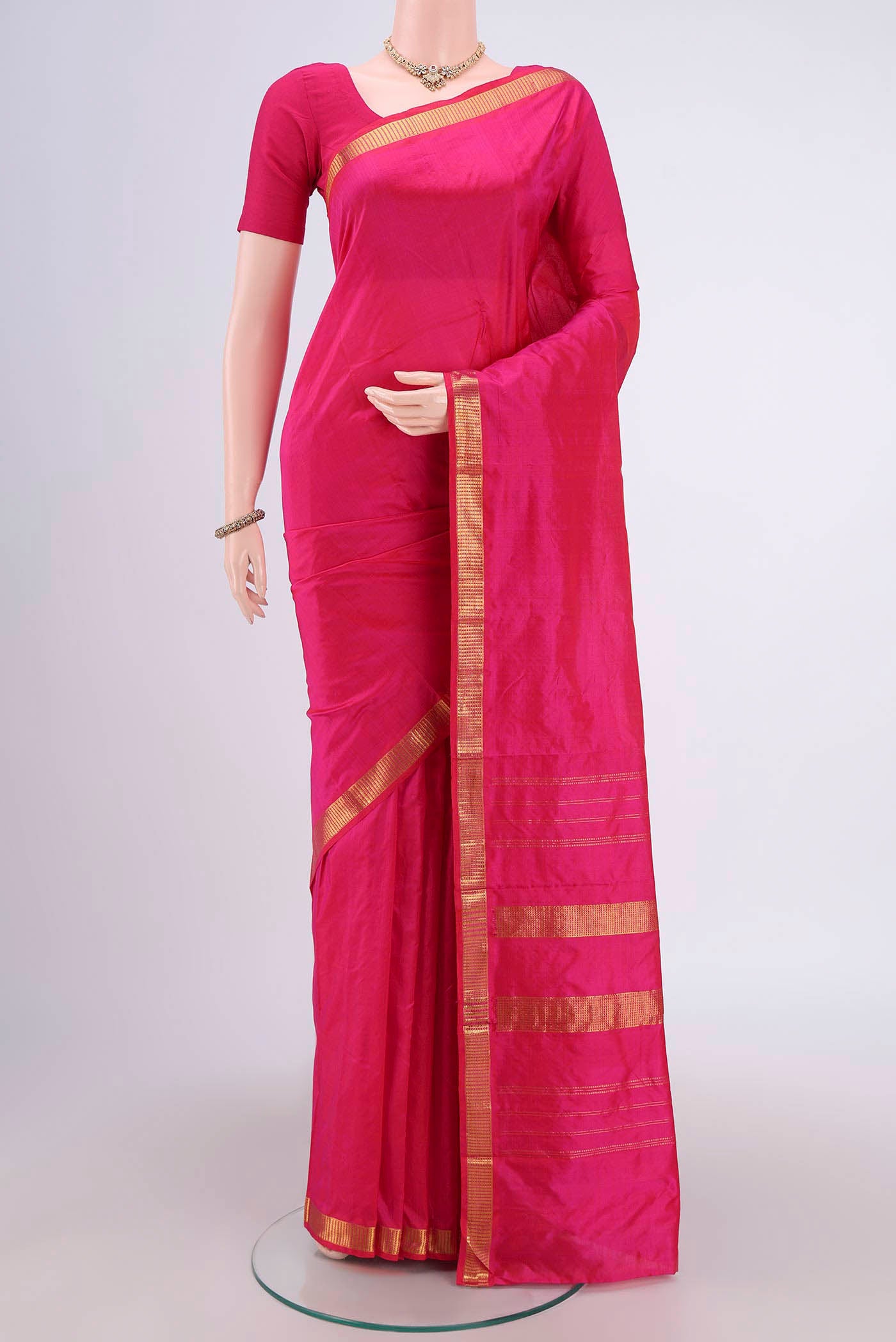 Rani Pink Dual Tone Kanchipuram Silk Saree with Plain Body and Zari Border.  displayed on a mannequin