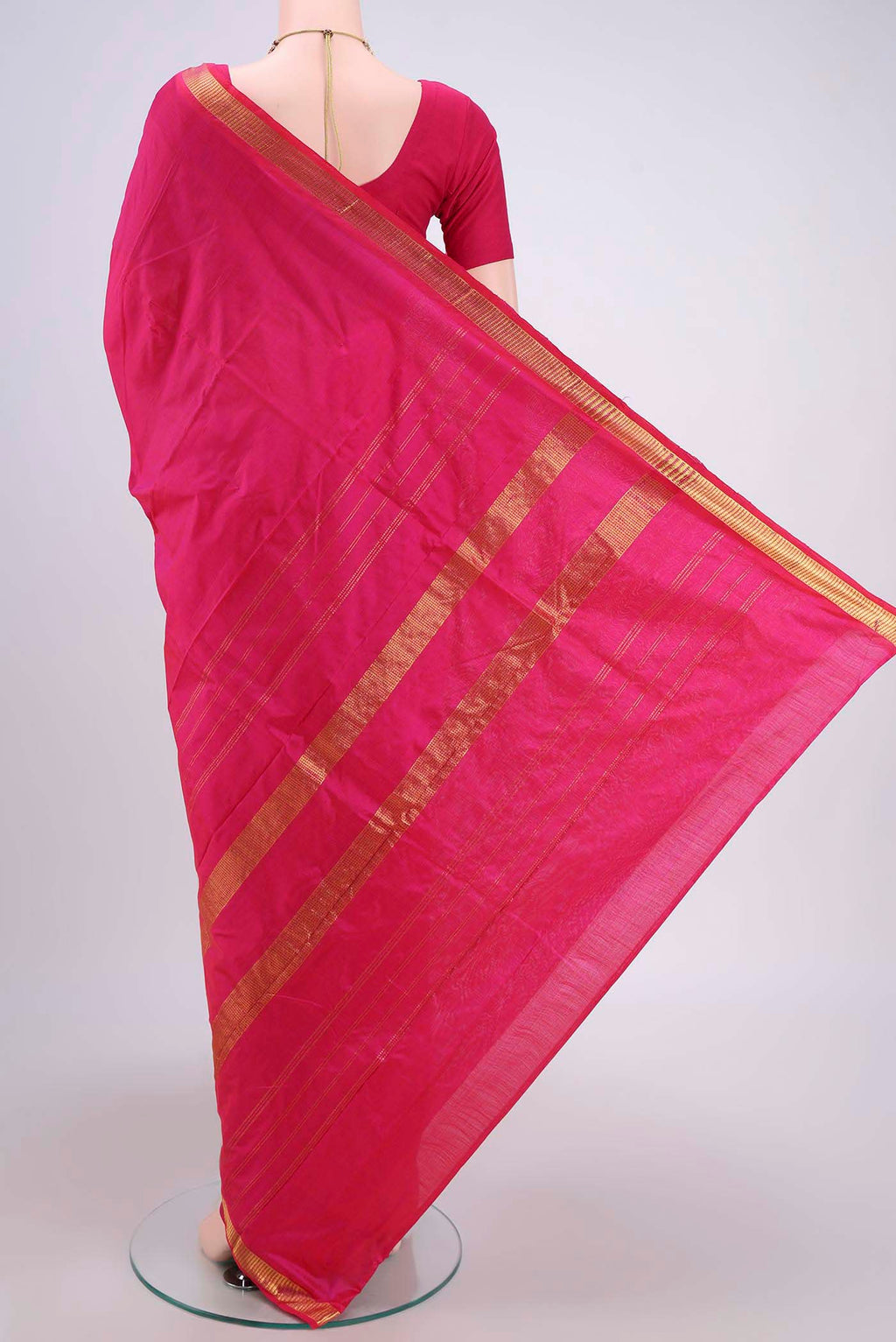 Flat view of Rani Pink Dual Tone Kanchipuram Silk Saree with Plain Body and Zari Border. 