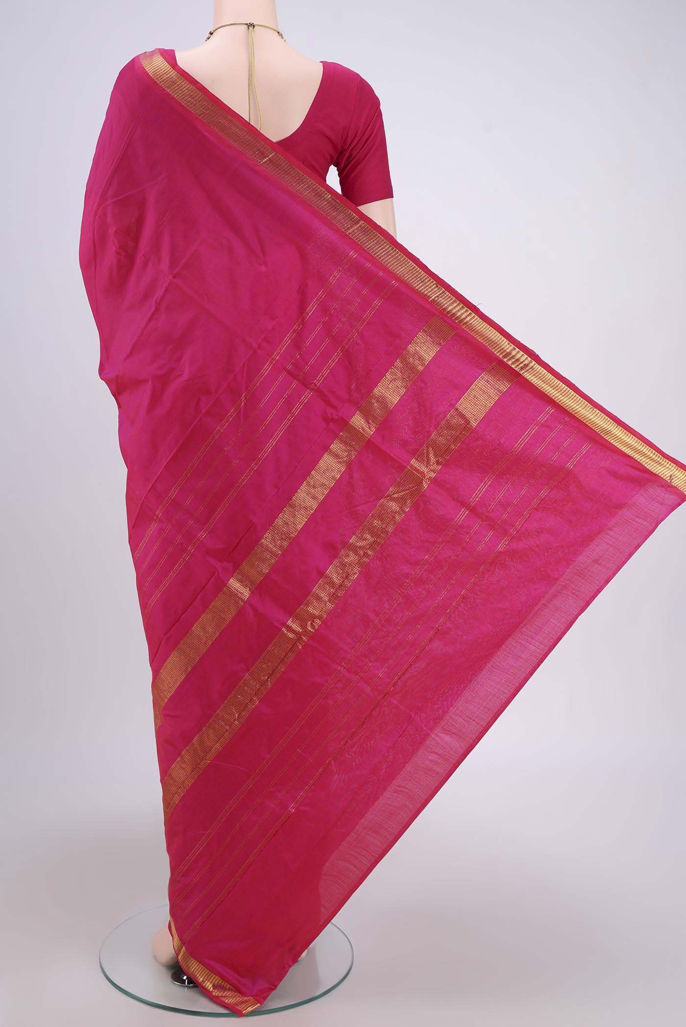 Flat view of Rani Pink Dual Tone Kanchipuram Silk Saree with Plain Body and Zari Border. 