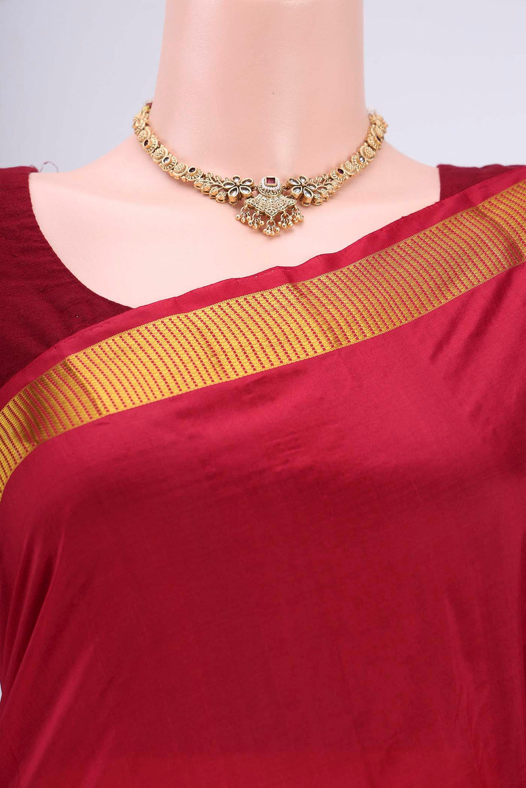 Border image of Maroon Kanjivaram Silk Saree with Plain Body and Zari Border. 