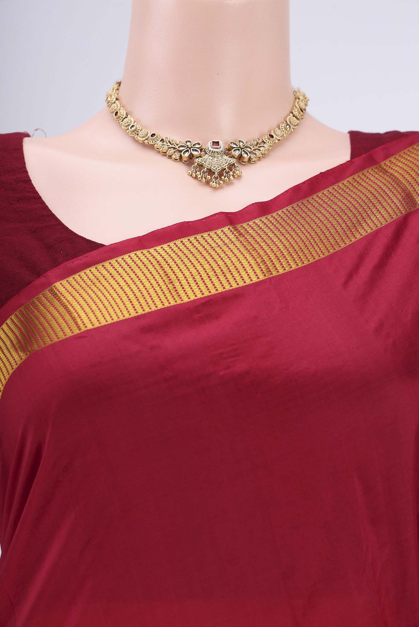 Border image of Maroon Kanjivaram Silk Saree with Plain Body and Zari Border. 