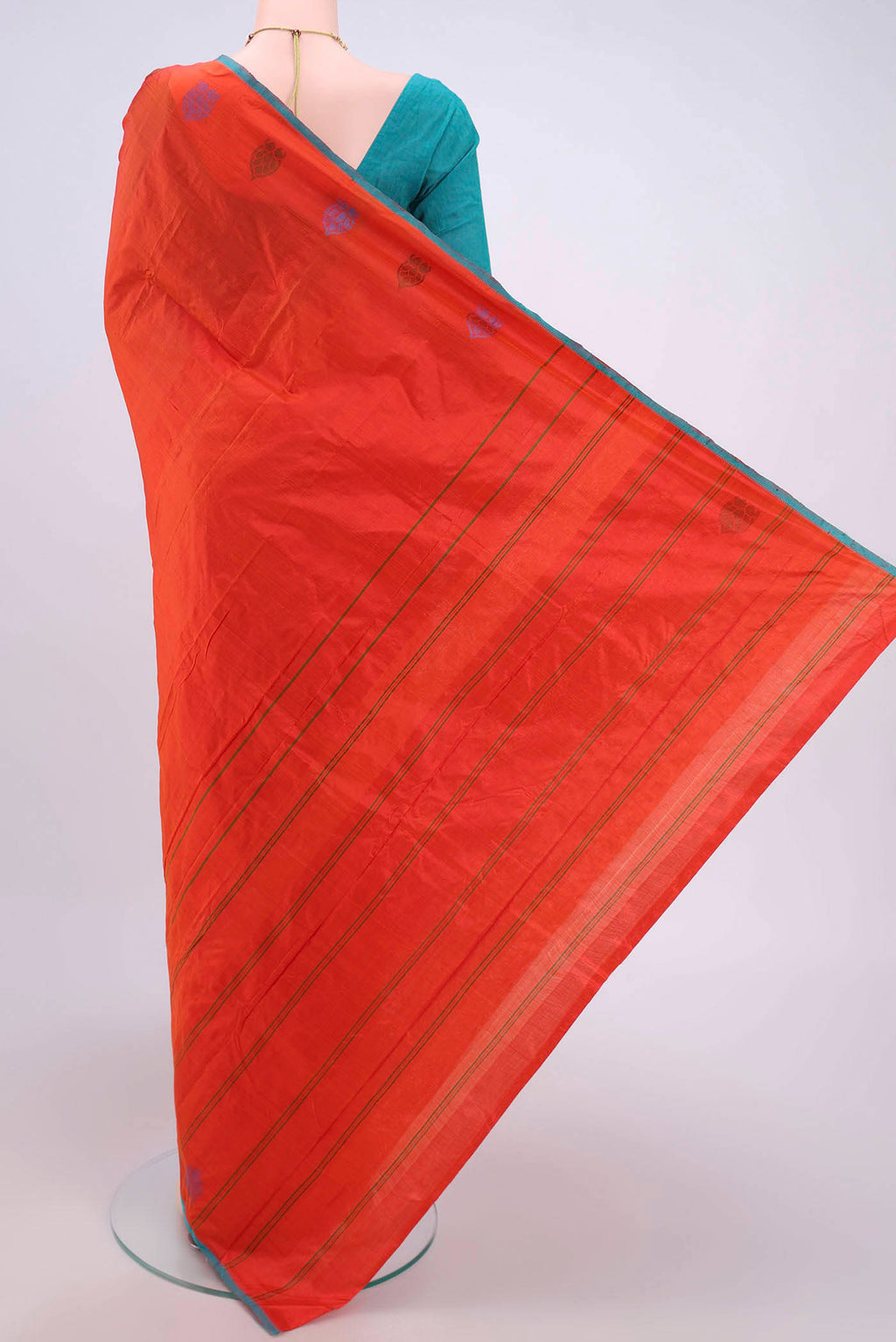 Flat view of Brick Orange Kanchipuram Saree with Plain Body and Thread Border. 