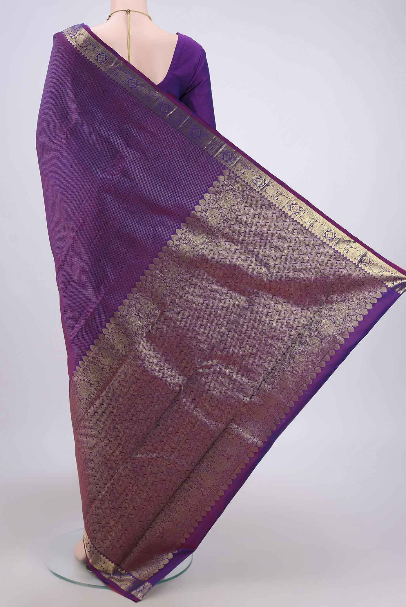 Flat view of Purple Dual Tone Kanchipuram Saree with Zari Brocade on the body and Zari Border. 