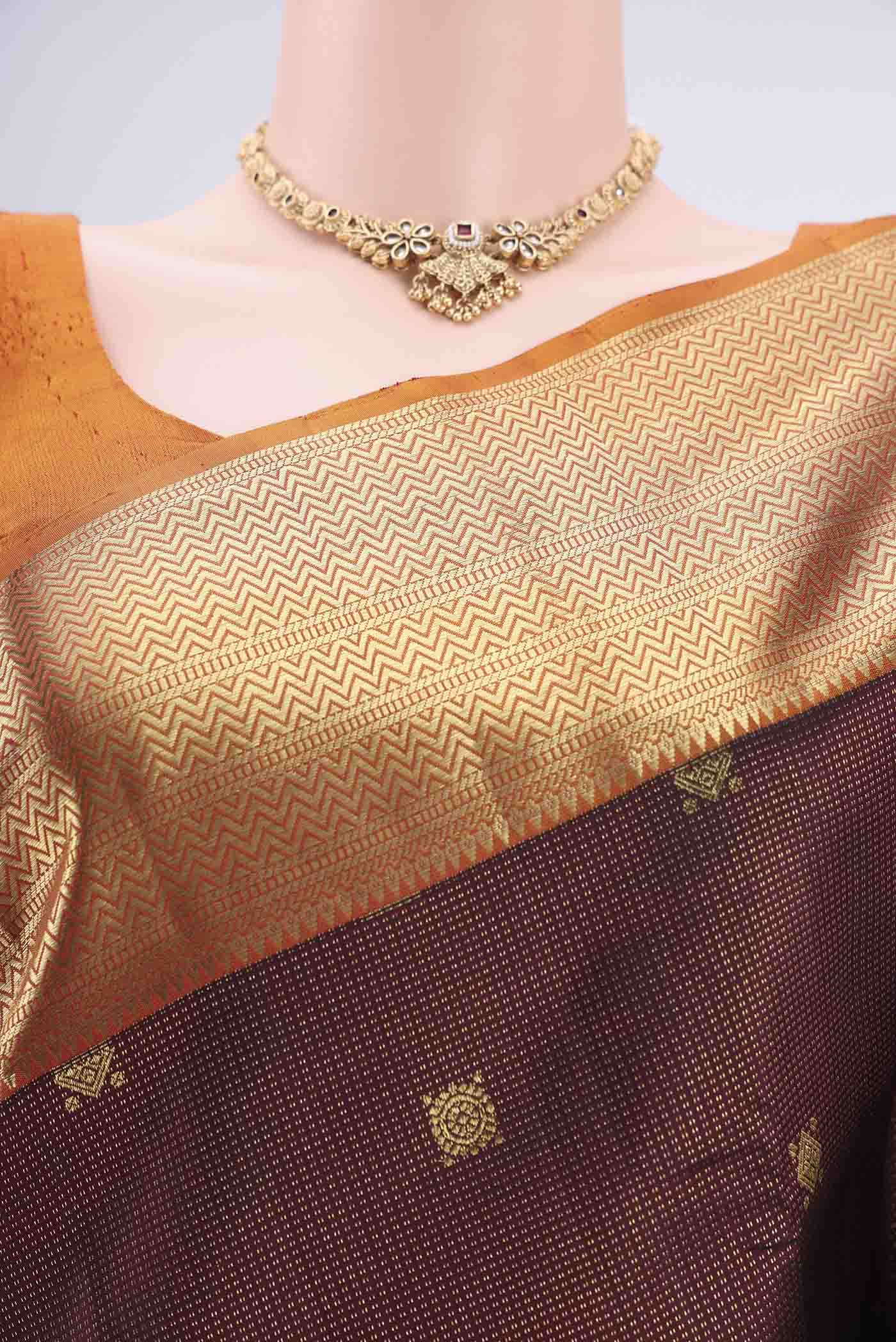 Border image of Maroon Kanjivaram Silk Saree with Zari Brocade on the body and Zari Border. 