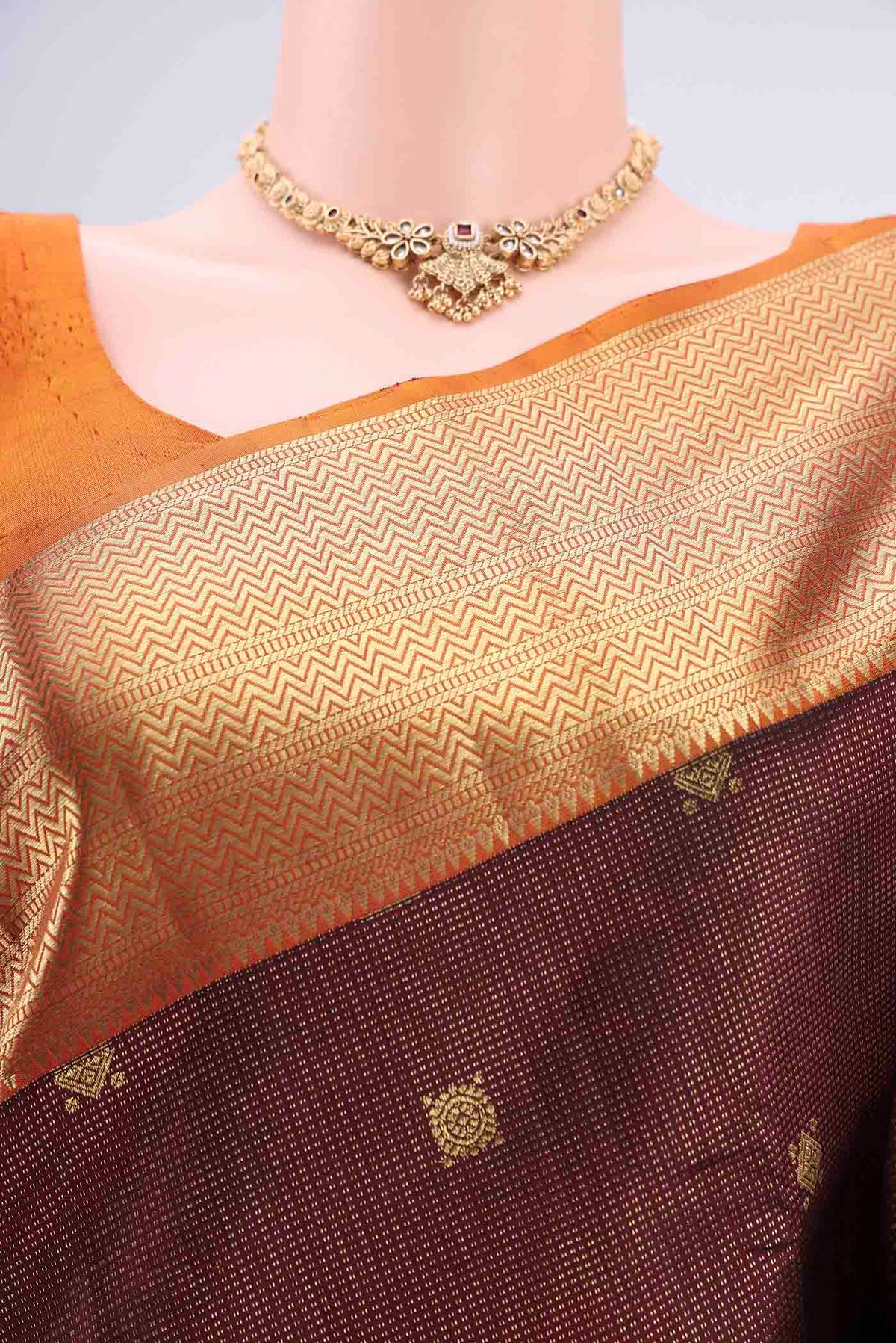 Border image of Maroon Kanjivaram Silk Saree with Zari Brocade on the body and Zari Border. 