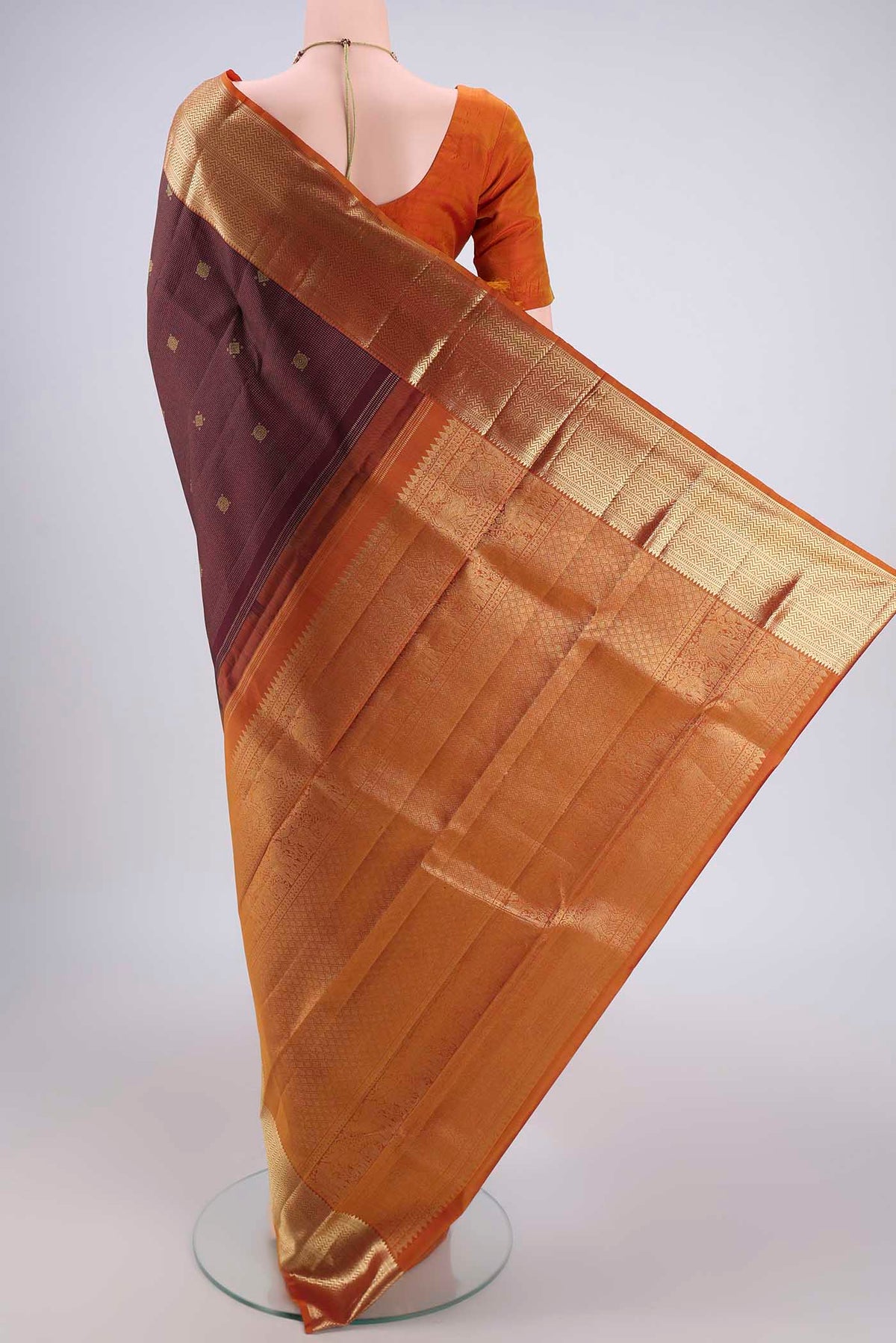 Flat view of Maroon Kanjivaram Silk Saree with Zari Brocade on the body and Zari Border. 