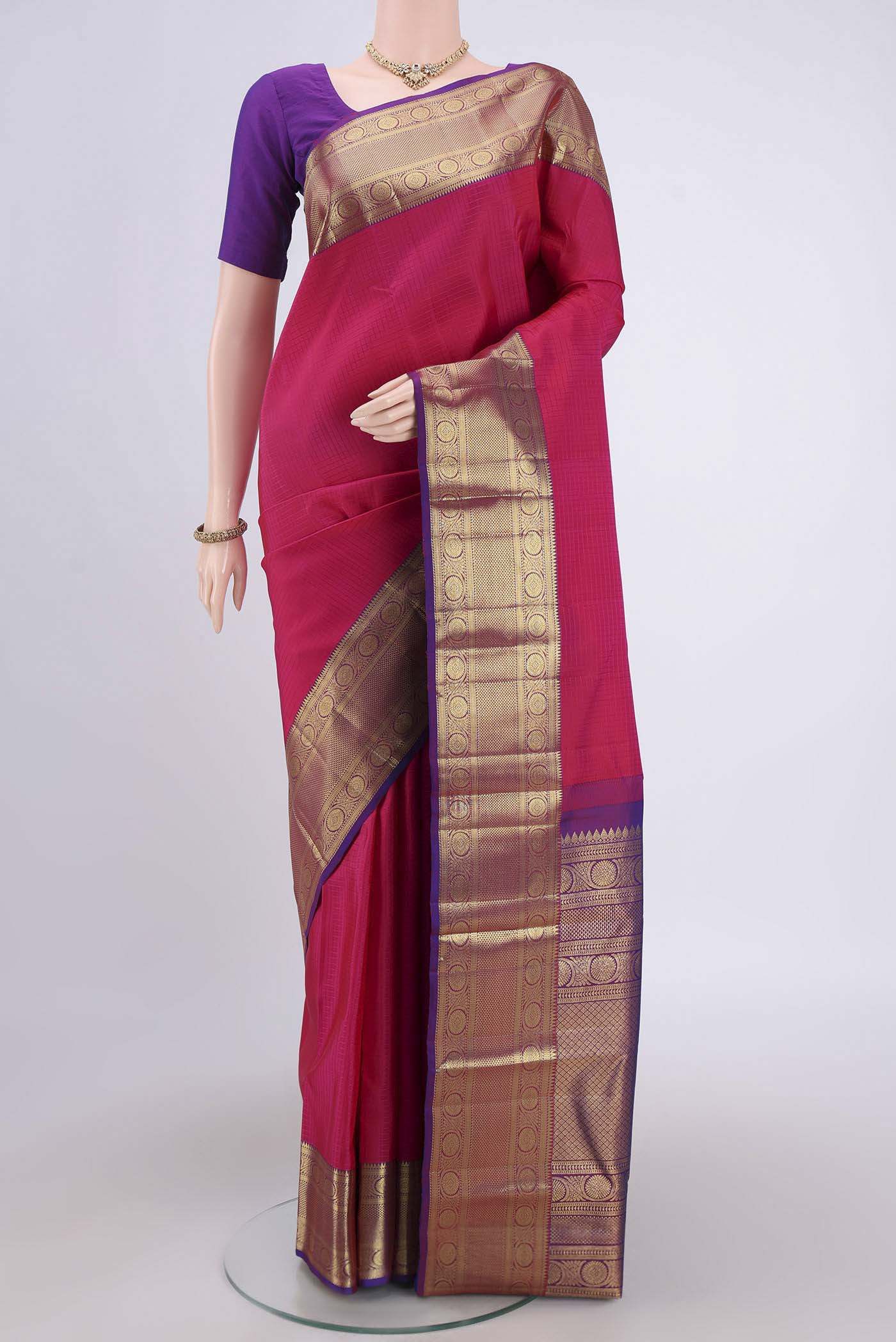 Dark Pink Kanjivaram Saree with Checked design on the body and Zari Border.  displayed on a mannequin