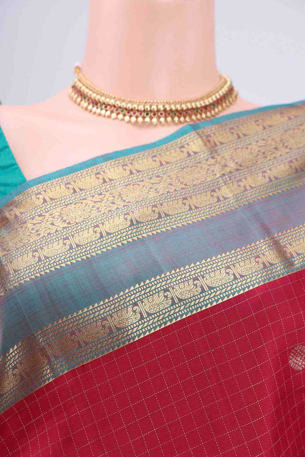 Border image of Maroon Kanjivaram Saree with Checked design on the body and Zari Border. 