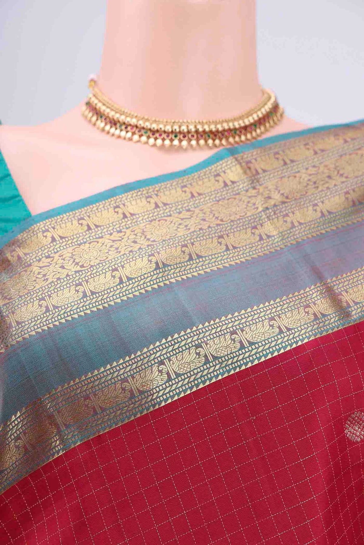 Border image of Maroon Kanjivaram Saree with Checked design on the body and Zari Border. 