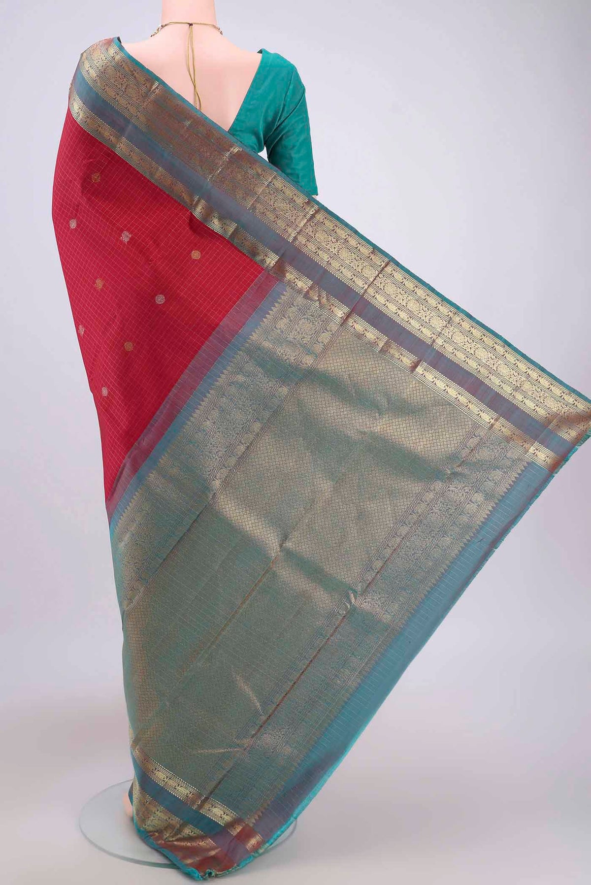 Flat view of Maroon Kanjivaram Saree with Checked design on the body and Zari Border. 