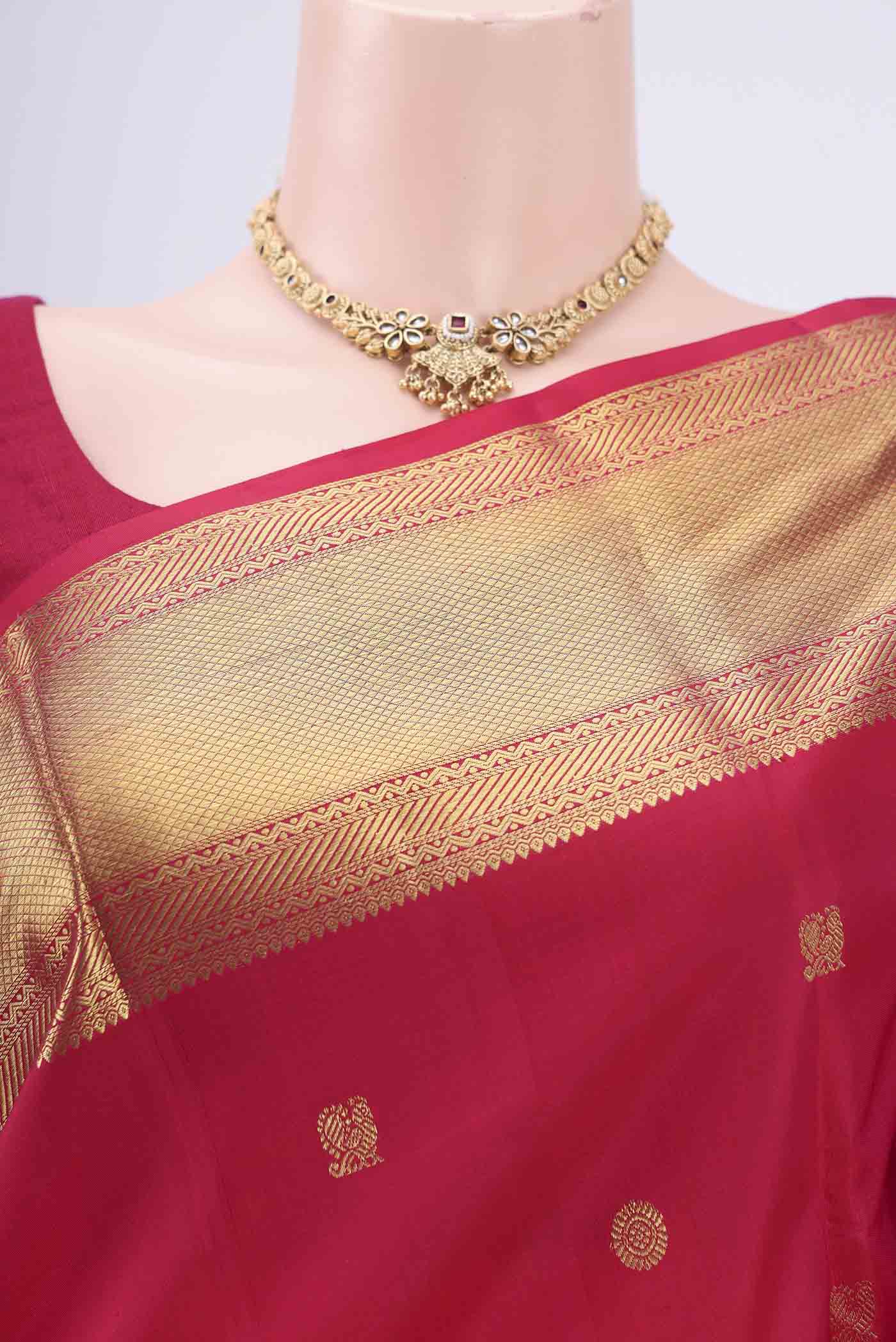 Border image of Dark Pink Kanchipuram Silk Saree with Zari Butta on the body and Zari Border. 
