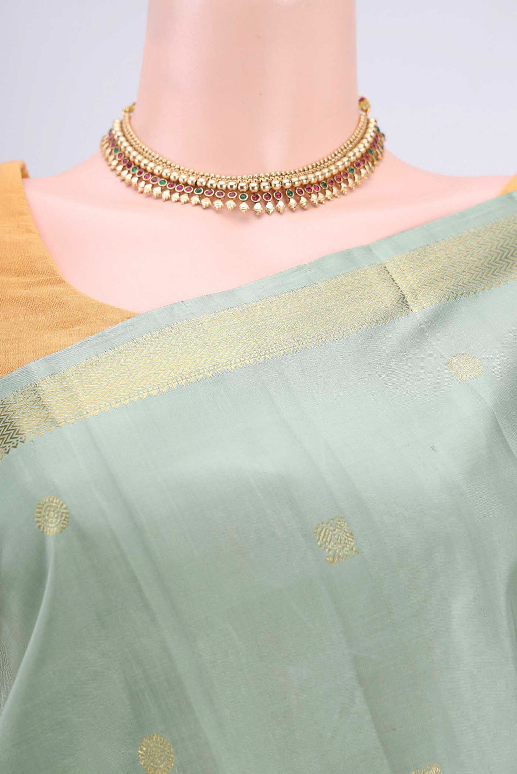 Border image of Sage Green Kanchipuram Saree with Zari Butta on the body and Zari Border. 
