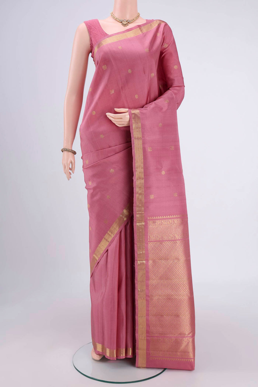 Rose pink Nangavalli Silk [ Salem ] Saree with Zari Butta on the body and Zari Border.  displayed on a mannequin