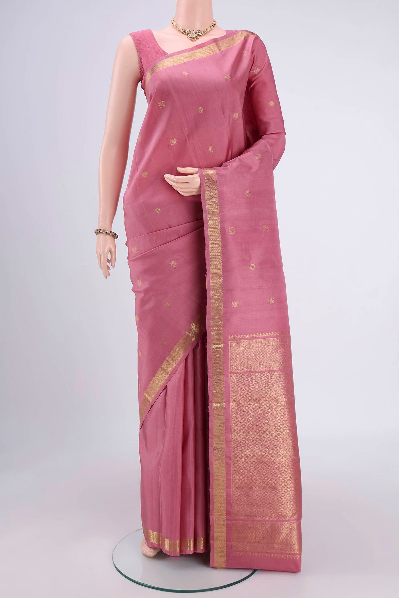 Rose pink Nangavalli Silk [ Salem ] Saree with Zari Butta on the body and Zari Border.  displayed on a mannequin