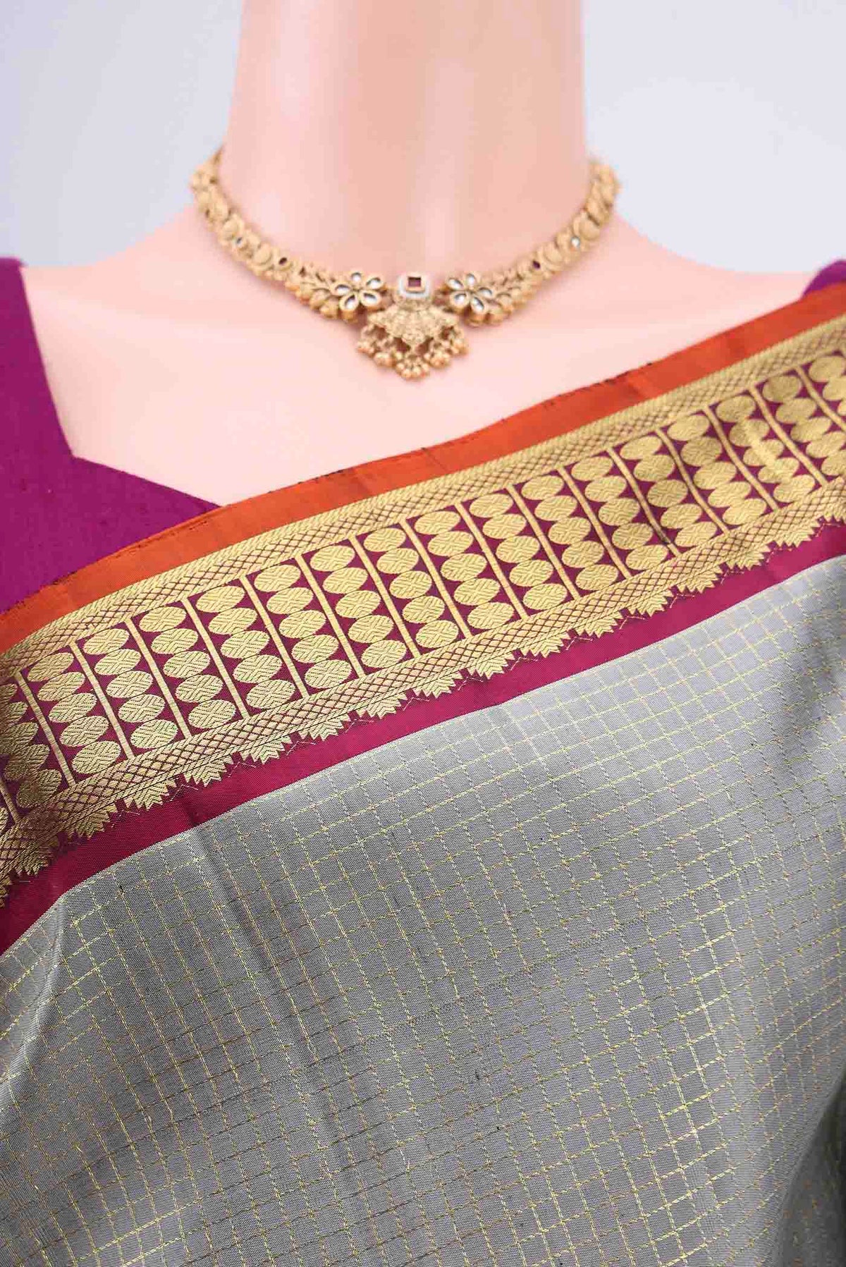 Border image of Grey Dual Tone Kanchipuram Saree with Checked design on the body and Zari Border. 