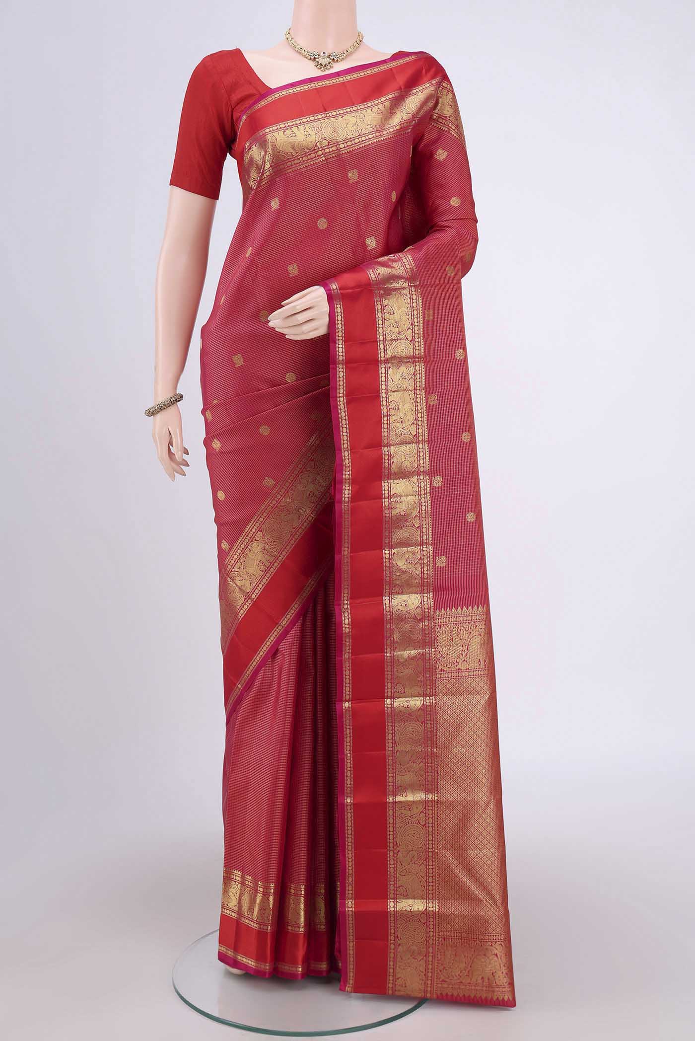 Dark Pink Dual Tone Kanjivaram Saree with Checked design on the body and Zari Border.  displayed on a mannequin