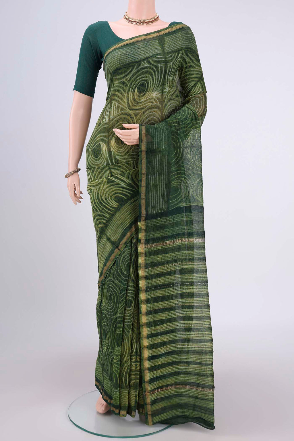 Green Dual Tone Chanderi Silk Saree with Printed design on the body and Thin Zari Line.  displayed on a mannequin
