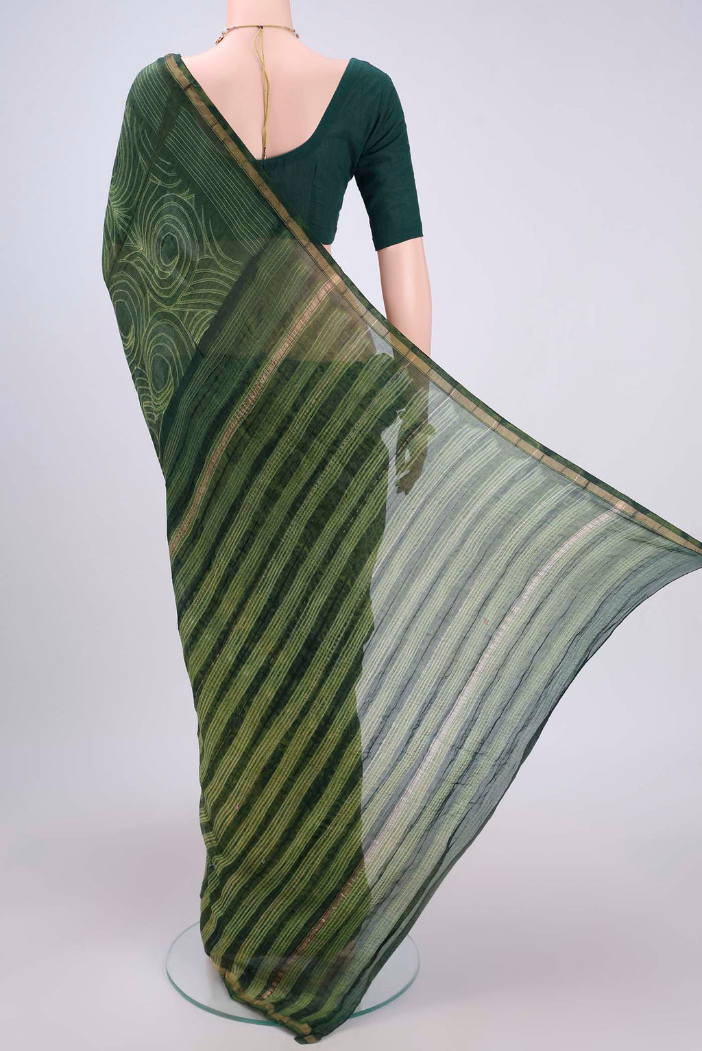 Flat view of Green Dual Tone Chanderi Silk Saree with Printed design on the body and Thin Zari Line. 