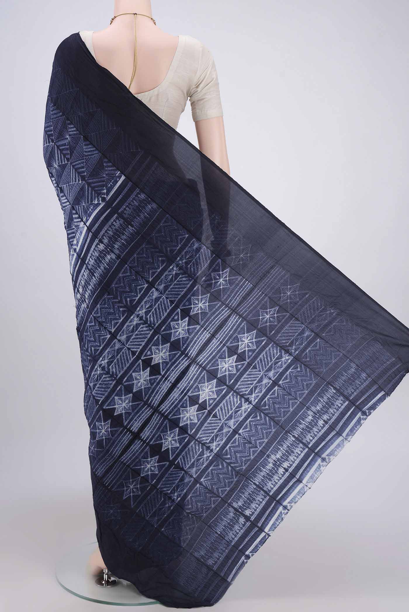 Flat view of Navy Blue Printed Silk Saree with Printed design on the body and Plain Border. 