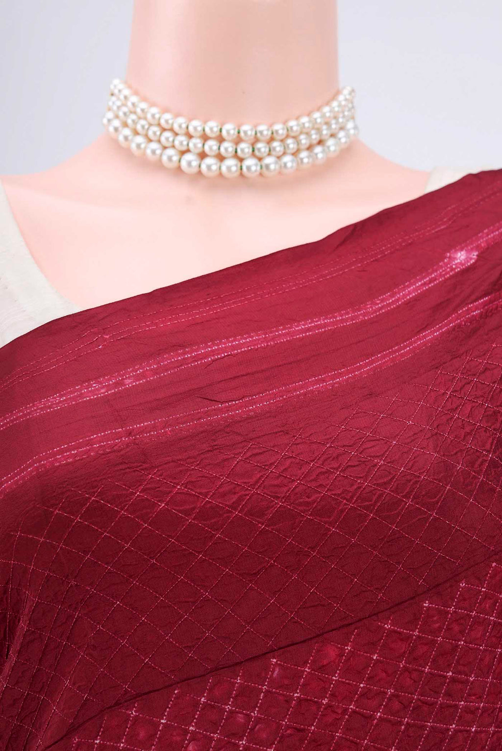 Border image of Maroon Printed Silk Saree with Printed design on the body and Plain Border. 