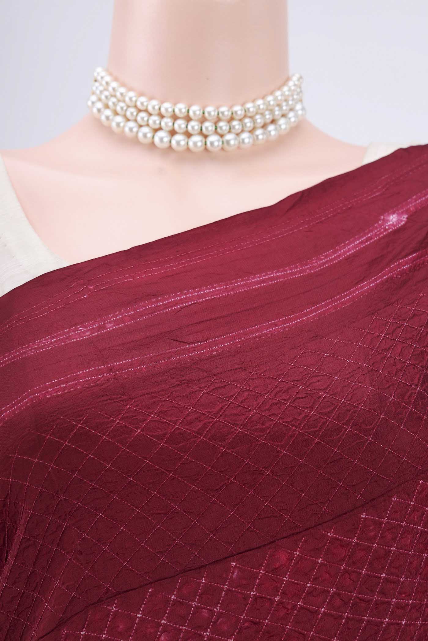 Border image of Maroon Printed Silk Saree with Printed design on the body and Plain Border. 