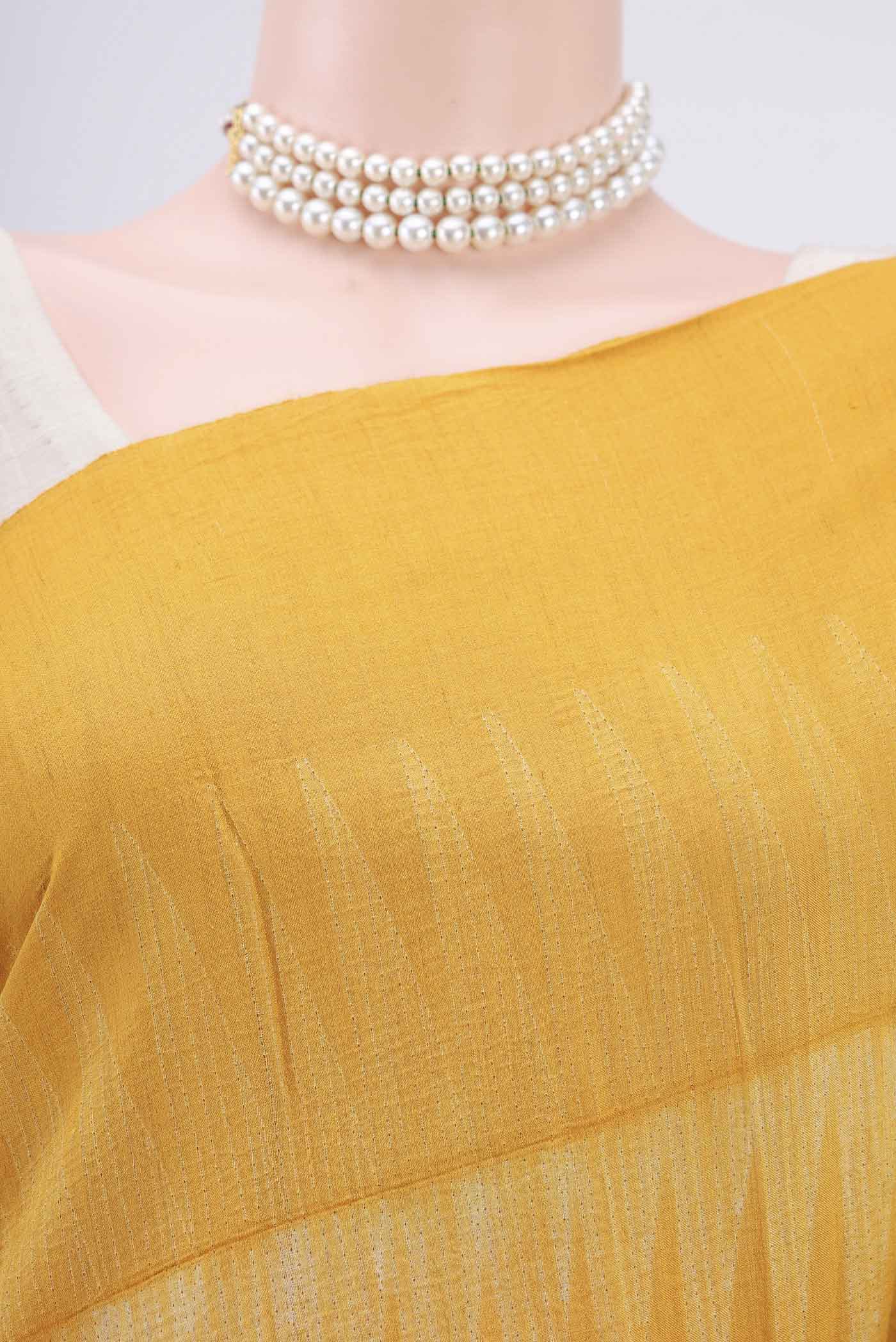 Border image of Mustard Printed Silk Saree with Printed design on the body and Plain Border. 
