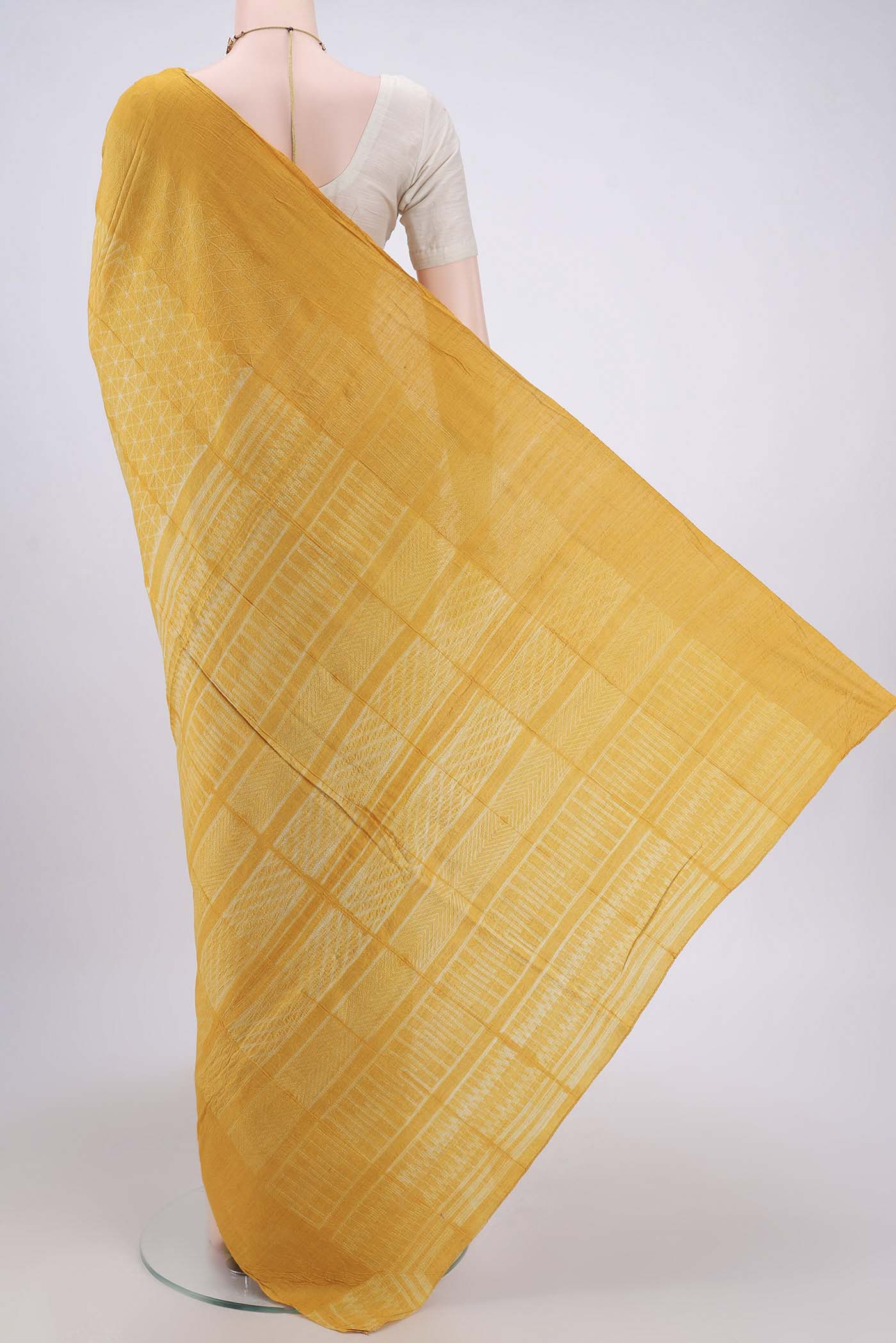 Flat view of Mustard Printed Silk Saree with Printed design on the body and Plain Border. 
