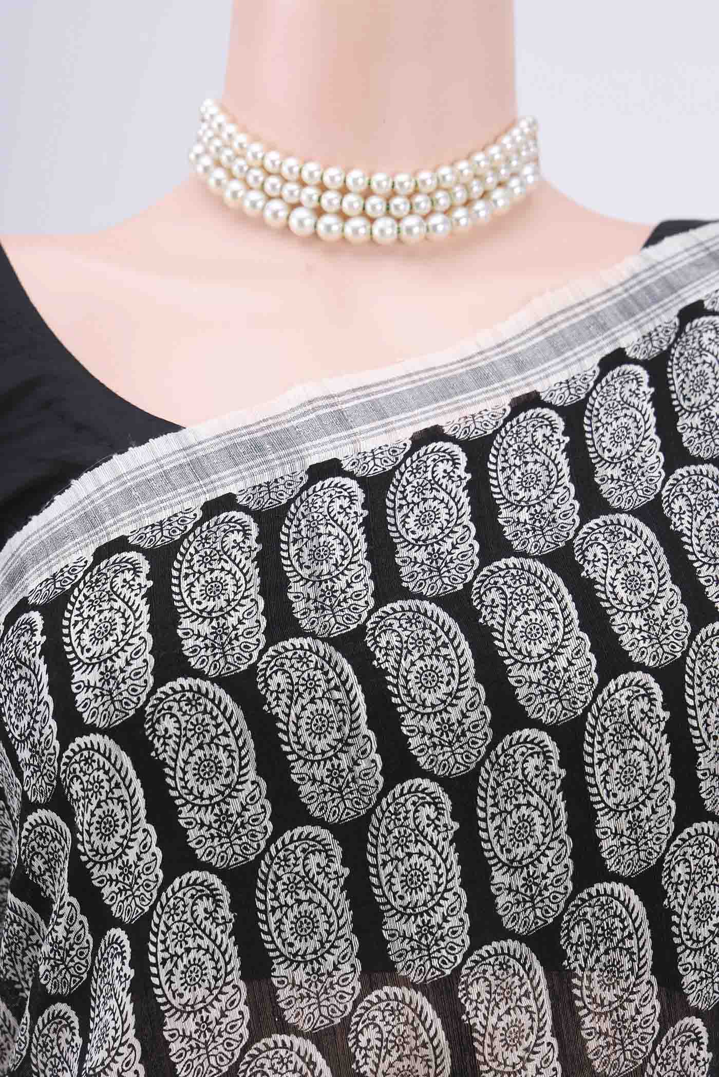 Border image of Black Dual Tone Tussar Silk Saree with Printed design on the body and Zari Border. 