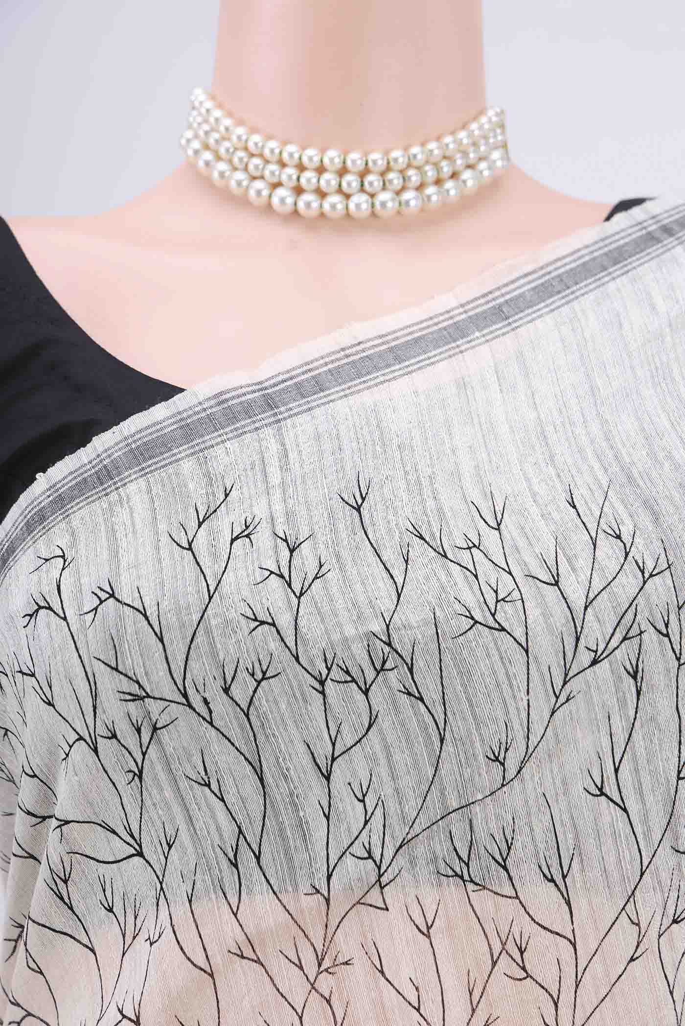 Border image of Pearl White Dual Tone Tussar Silk Saree with Printed design on the body and Zari Border. 