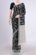 Black Dual Tone Tussar Silk Saree with Printed design on the body and Zari Border.  displayed on a mannequin