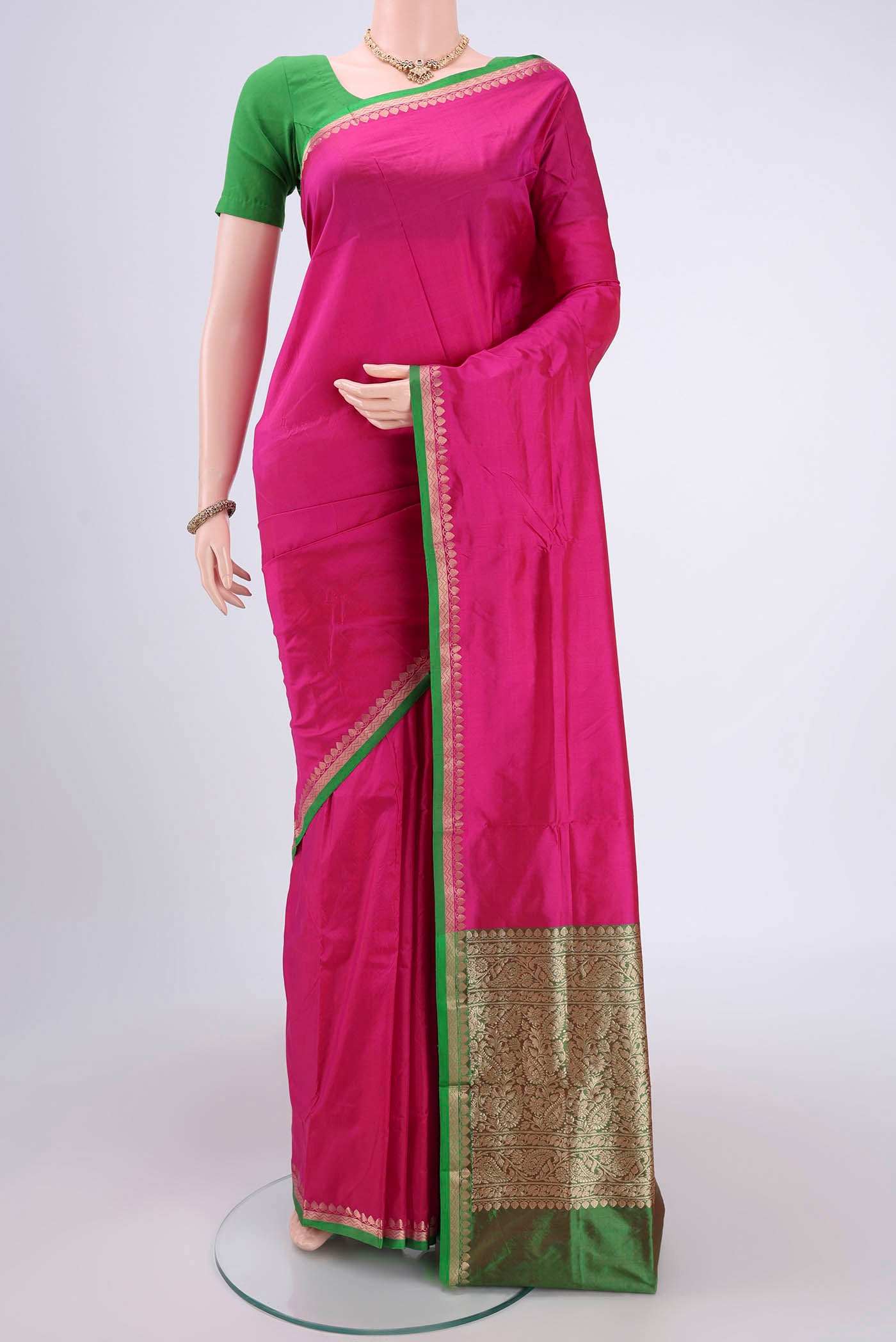 Pink Banarasi Katan Silk Saree with Zari Butta on the body and Zari Border.  displayed on a mannequin