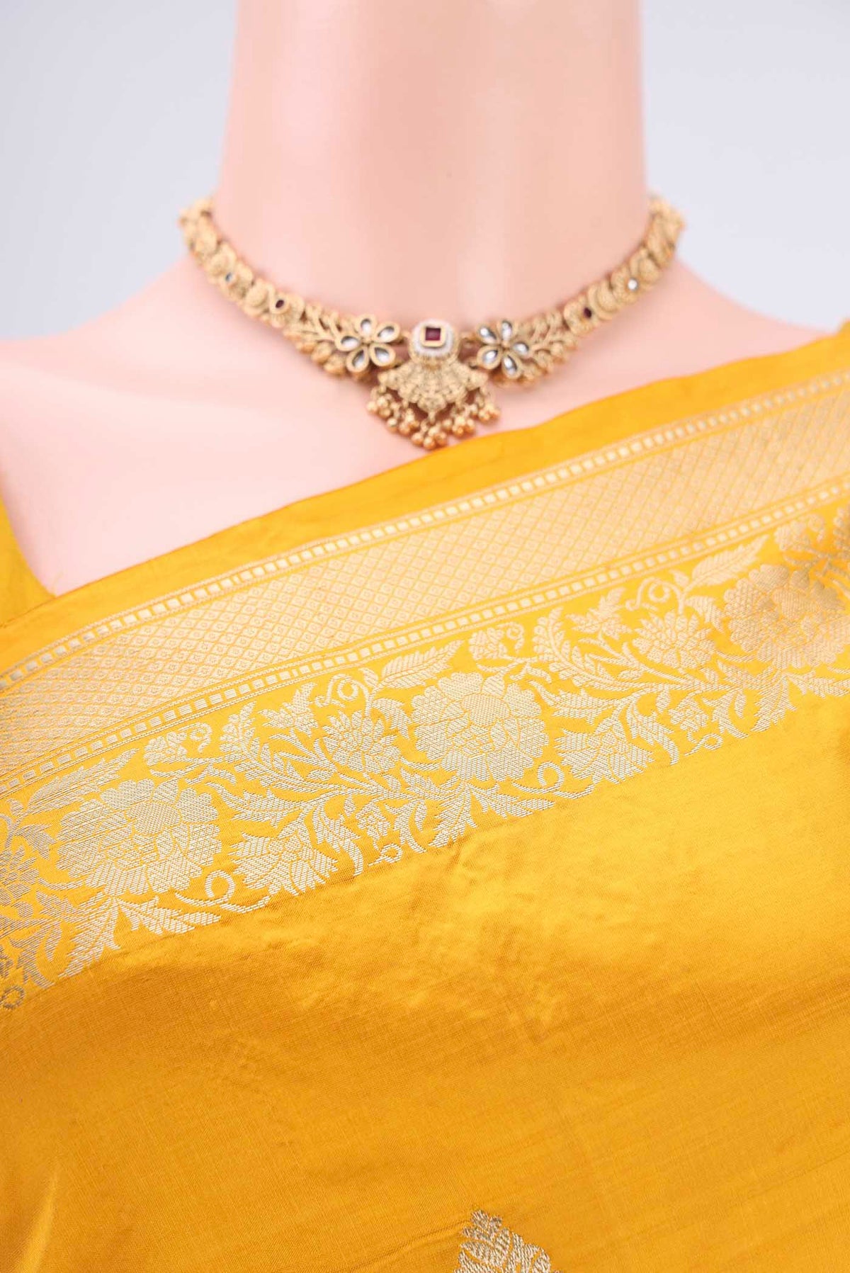 Border image of Yellow Banarasi Katan Silk Saree with Zari Butta on the body and Zari Border. 