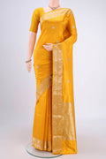 Yellow Banarasi Katan Silk Saree with Zari Butta on the body and Zari Border.  displayed on a mannequin