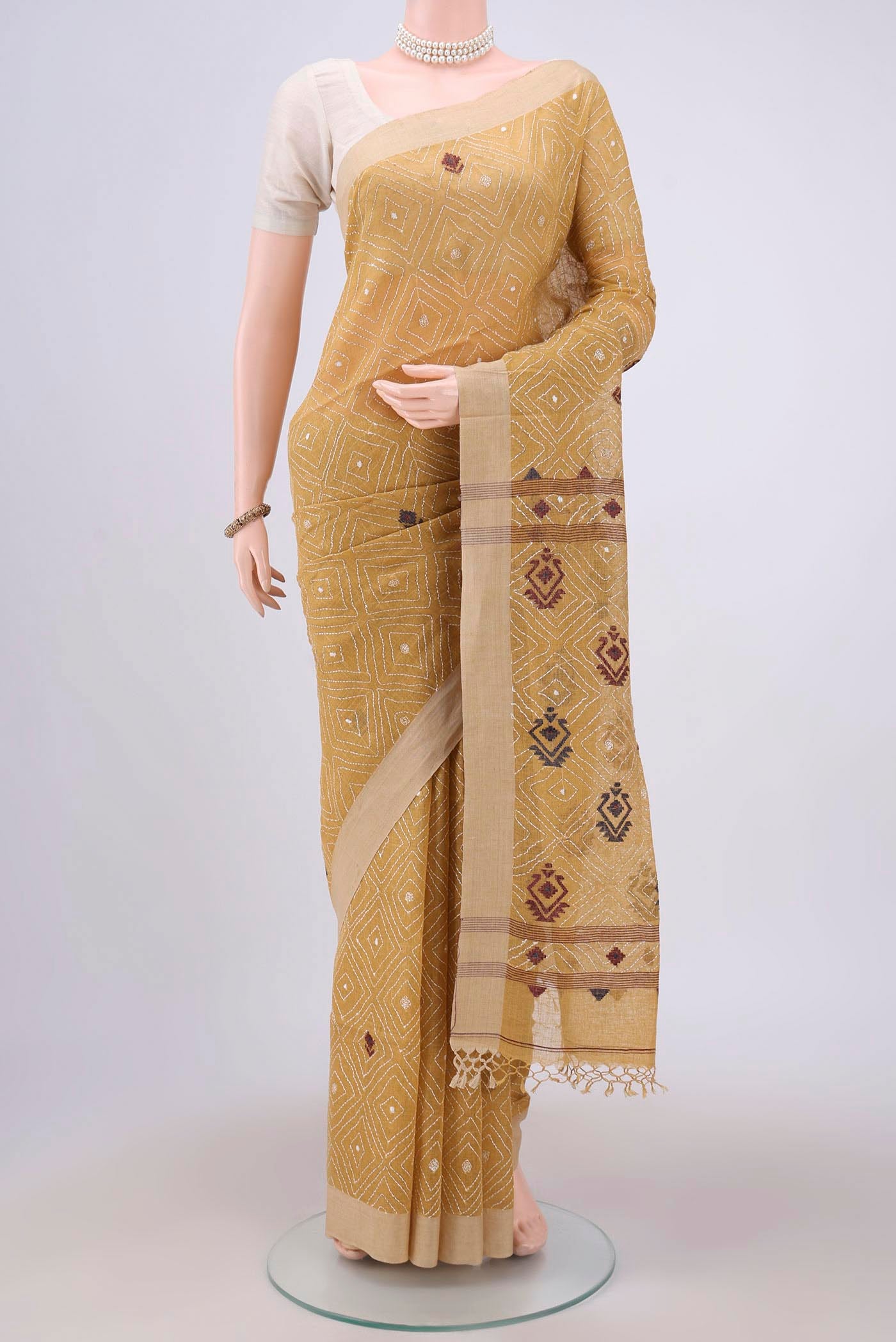 Mustard Bengal Cotton - Kantha Saree with Kantha Work on the body and Thread Border.  displayed on a mannequin