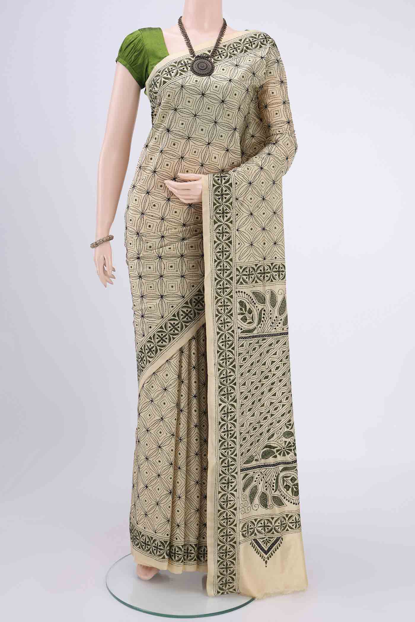 Cream Kantha Silk Saree with Kantha Work on the body and Thread Border.  displayed on a mannequin